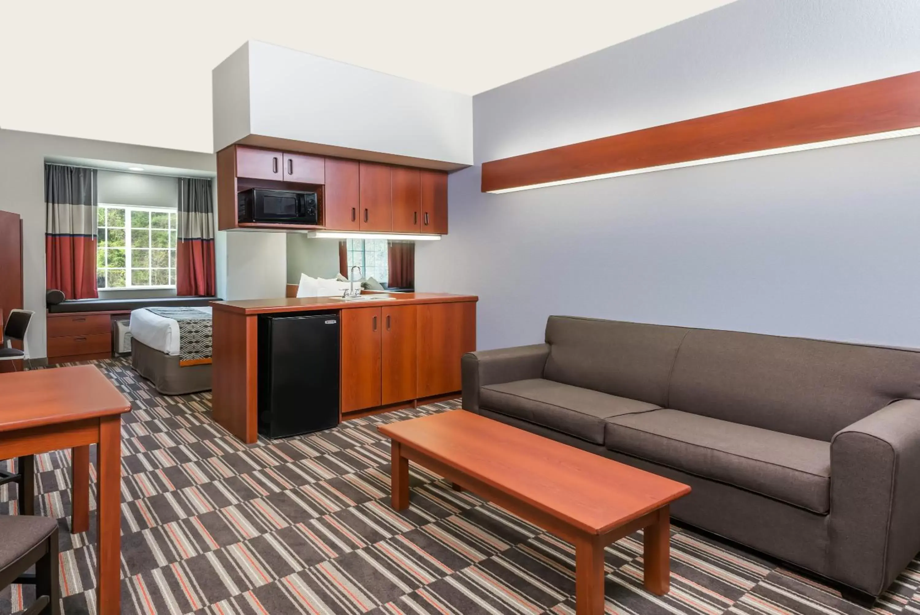 Bed, Seating Area in SureStay Plus Hotel by Best Western Morgantown