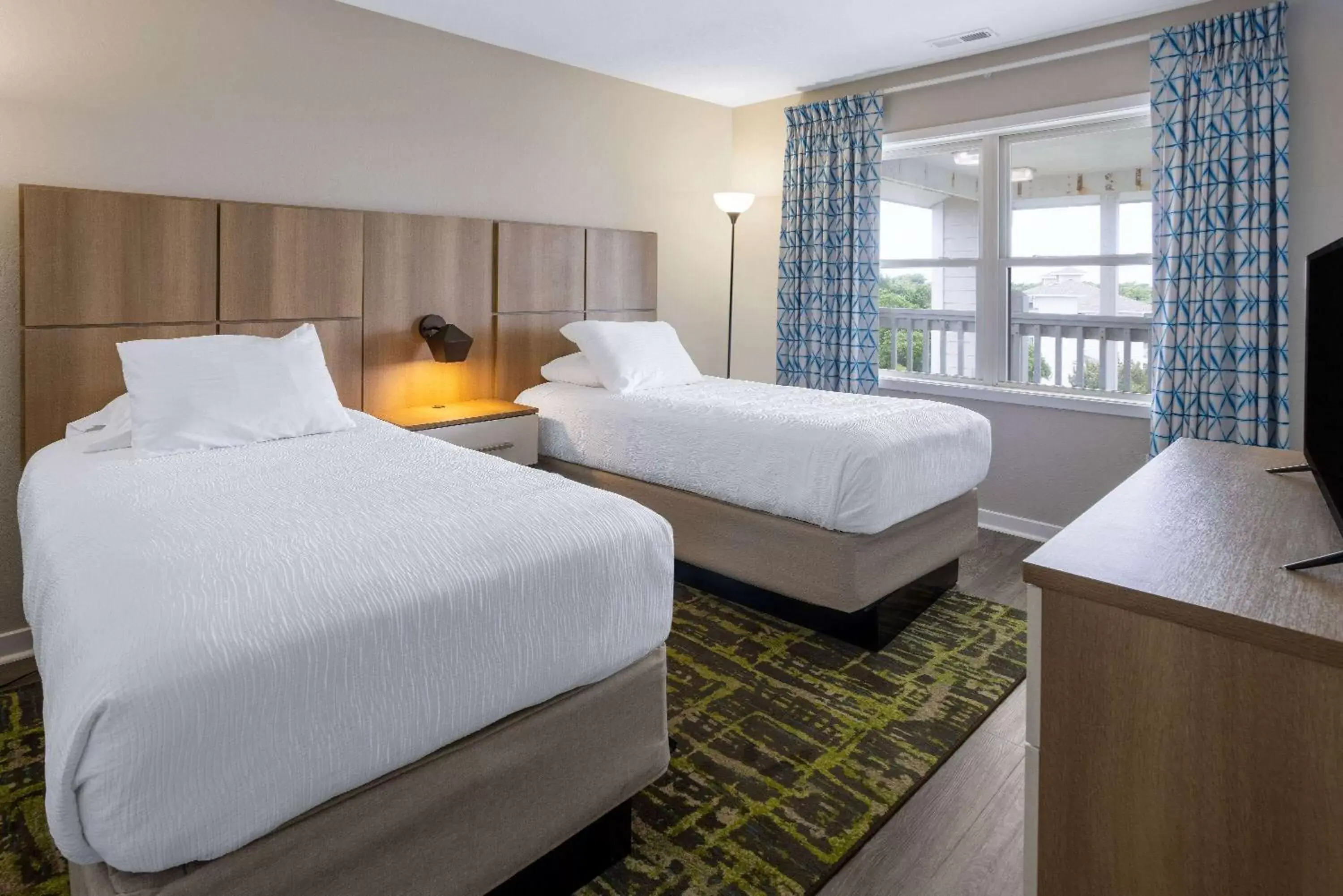 Bed in Atlantic Beach Resort, a Ramada by Wyndham