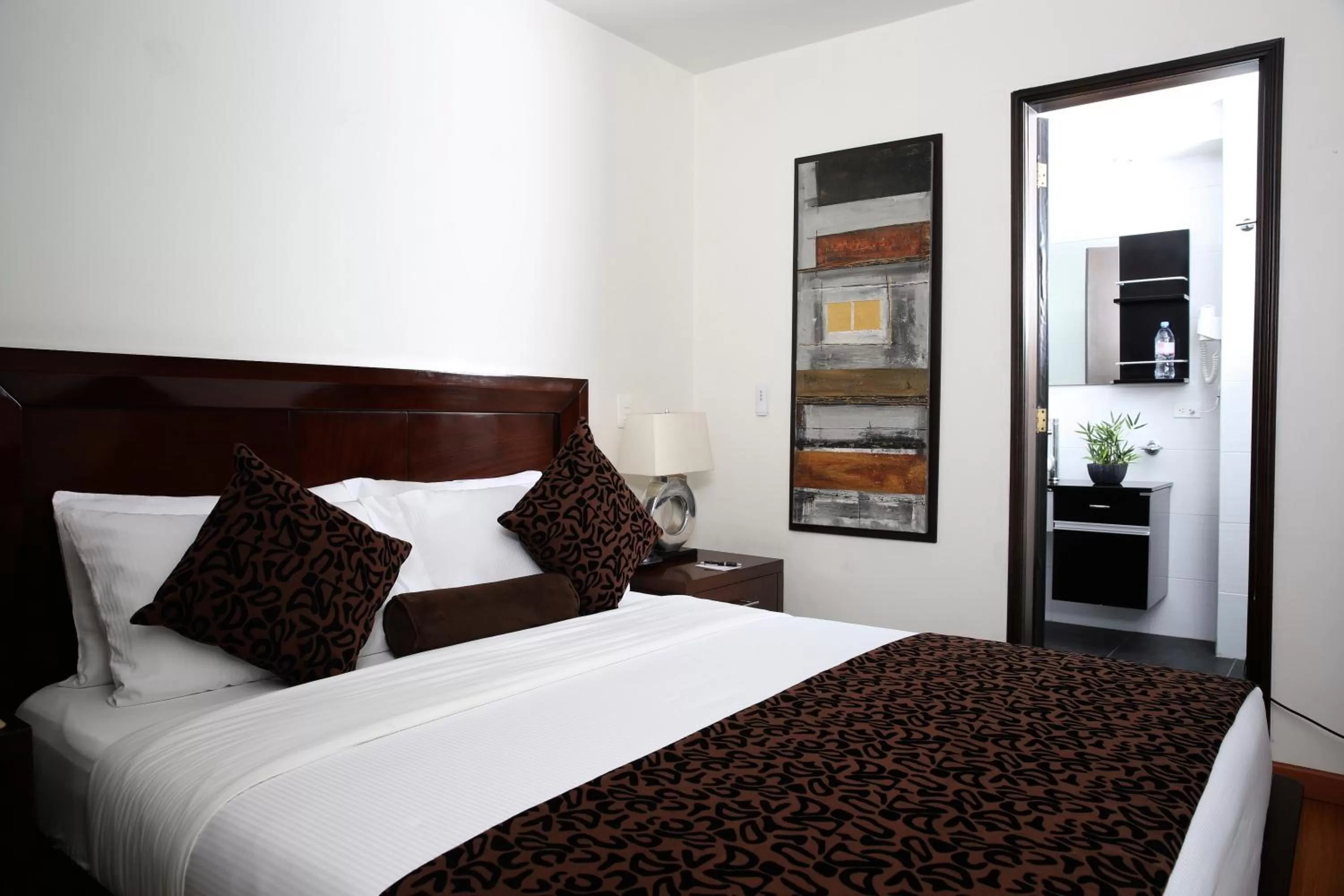 Bed in Hotel Suites 108