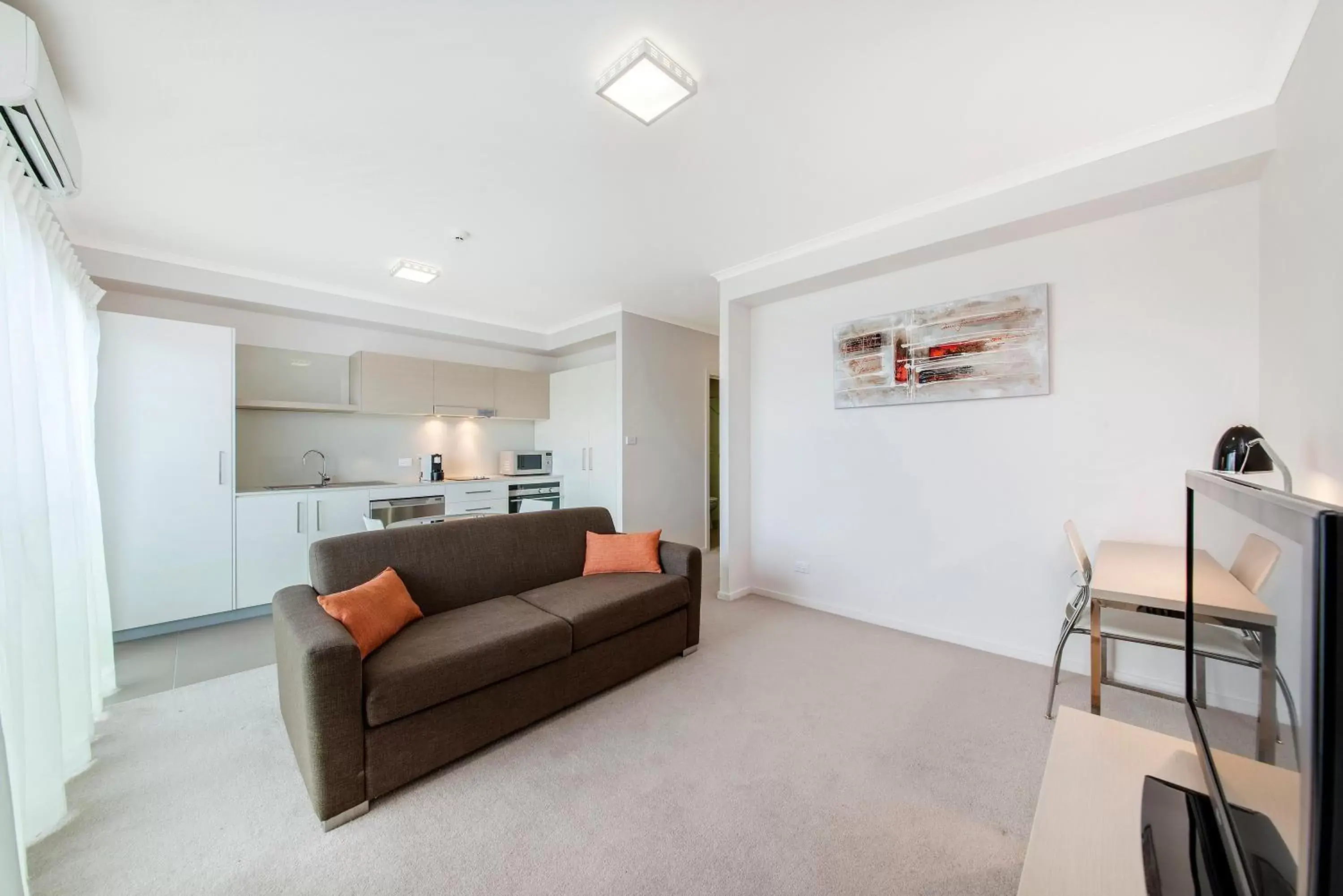 Bed, Seating Area in Abode Tuggeranong