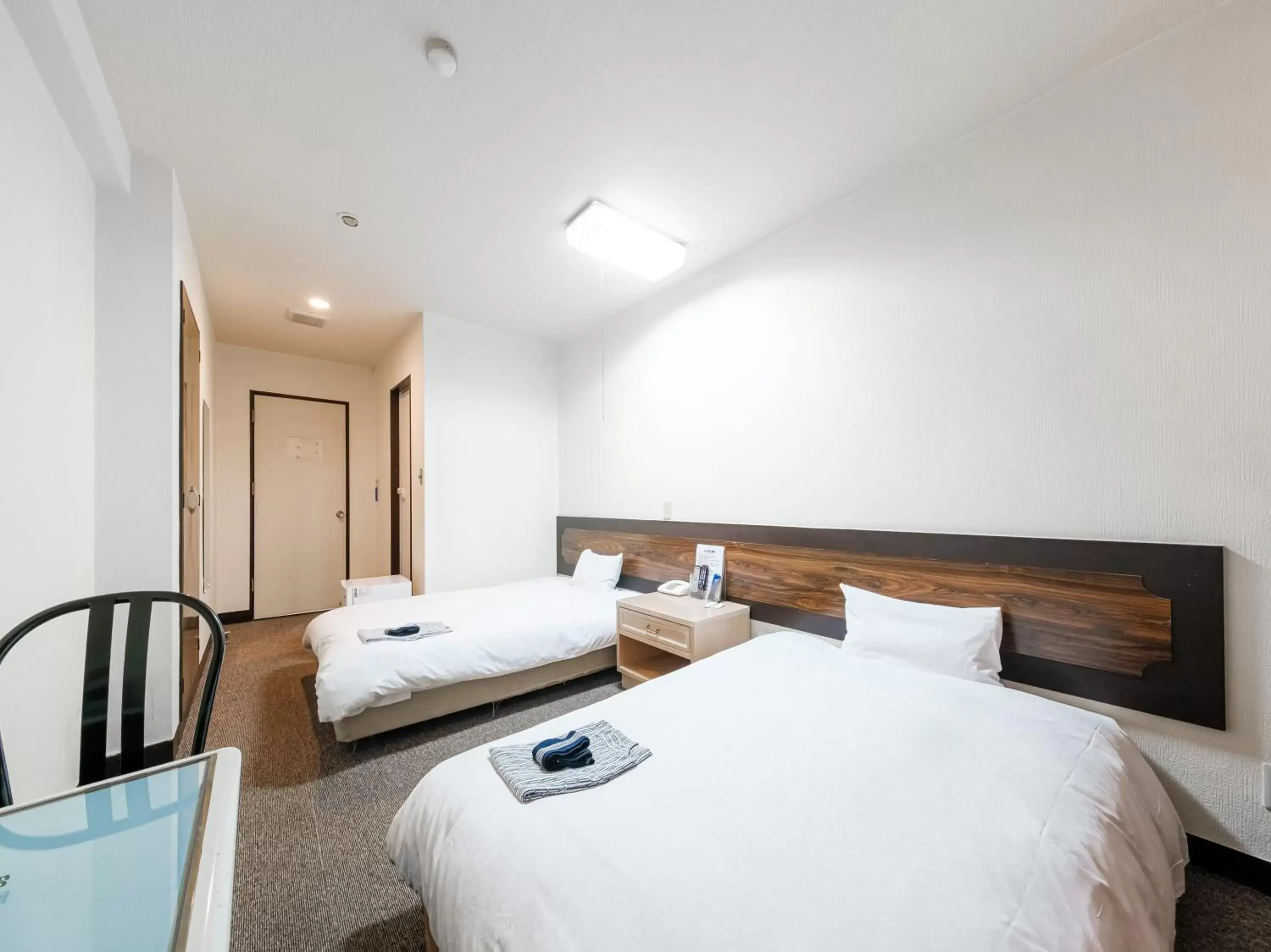 Bed in Tabist Hotel Tetora Hakodate Station