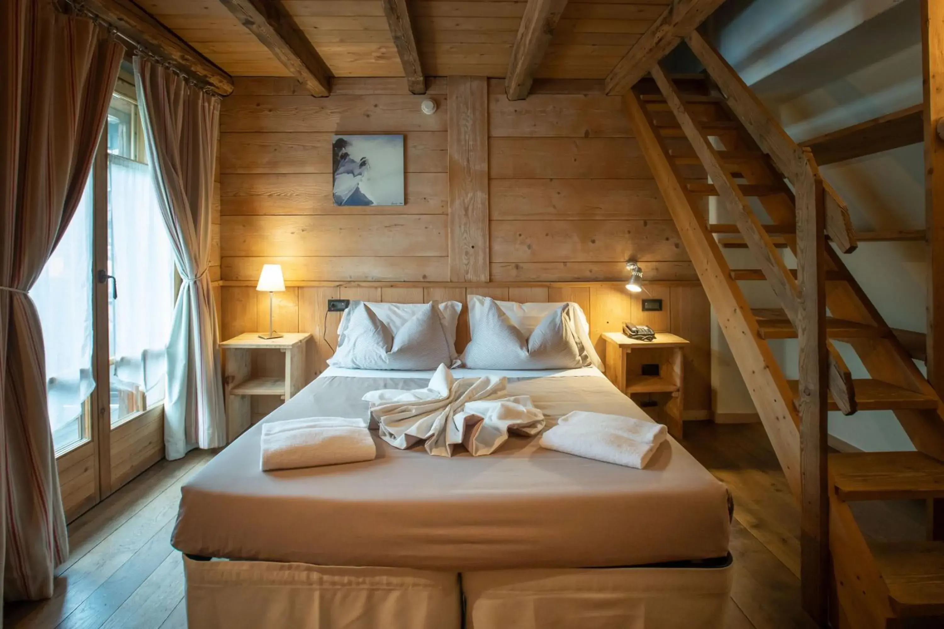 Bed in Hotel Chalet Svizzero