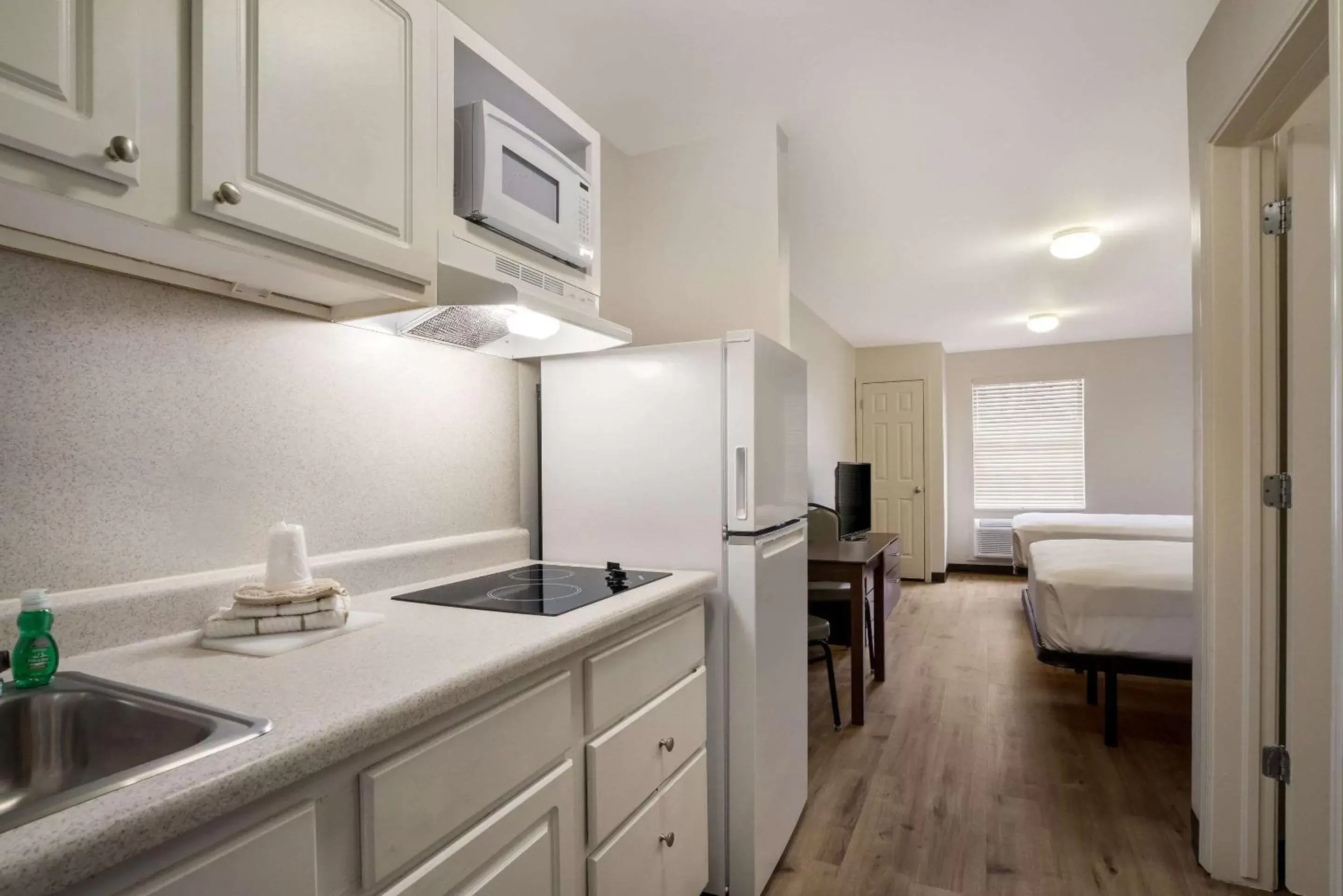 Bedroom, Kitchen/Kitchenette in Suburban Extended Stay Hotel Denver Central-Arvada