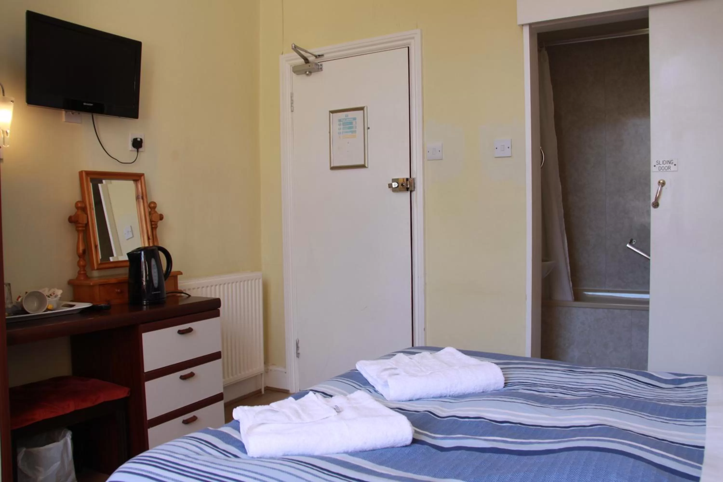 Bed in Ambassador Hotel