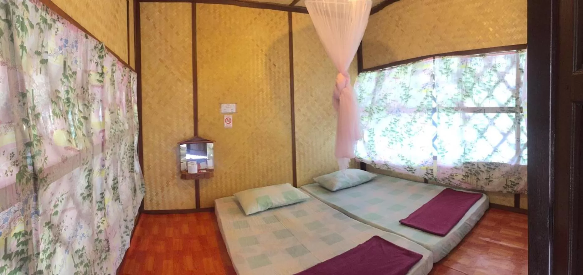 Bed in Bamboo House Resort