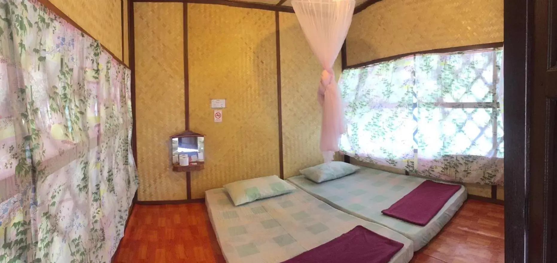 Bed in Bamboo House Resort
