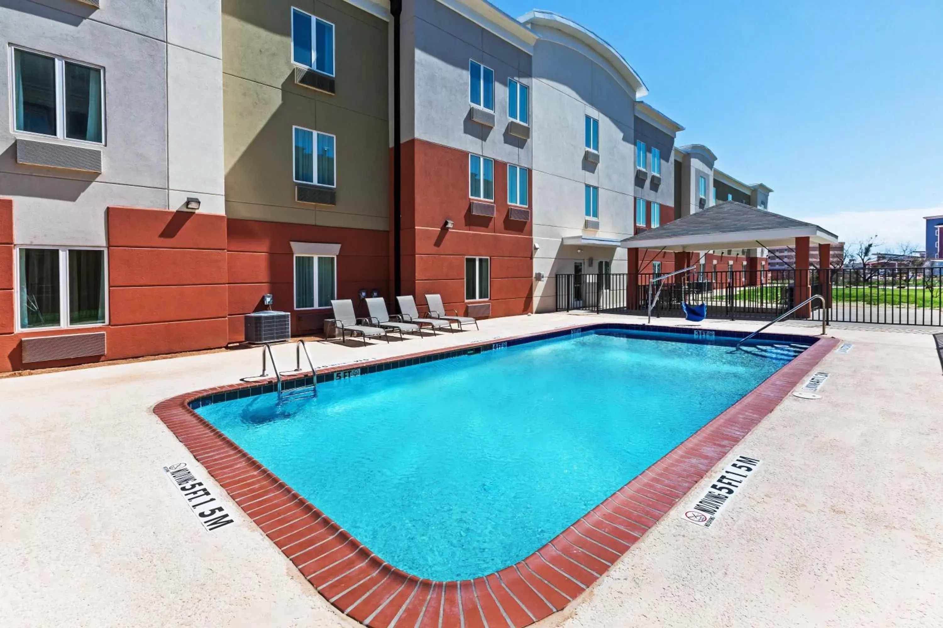 Swimming pool, Property Building in Candlewood Suites San Angelo, an IHG Hotel
