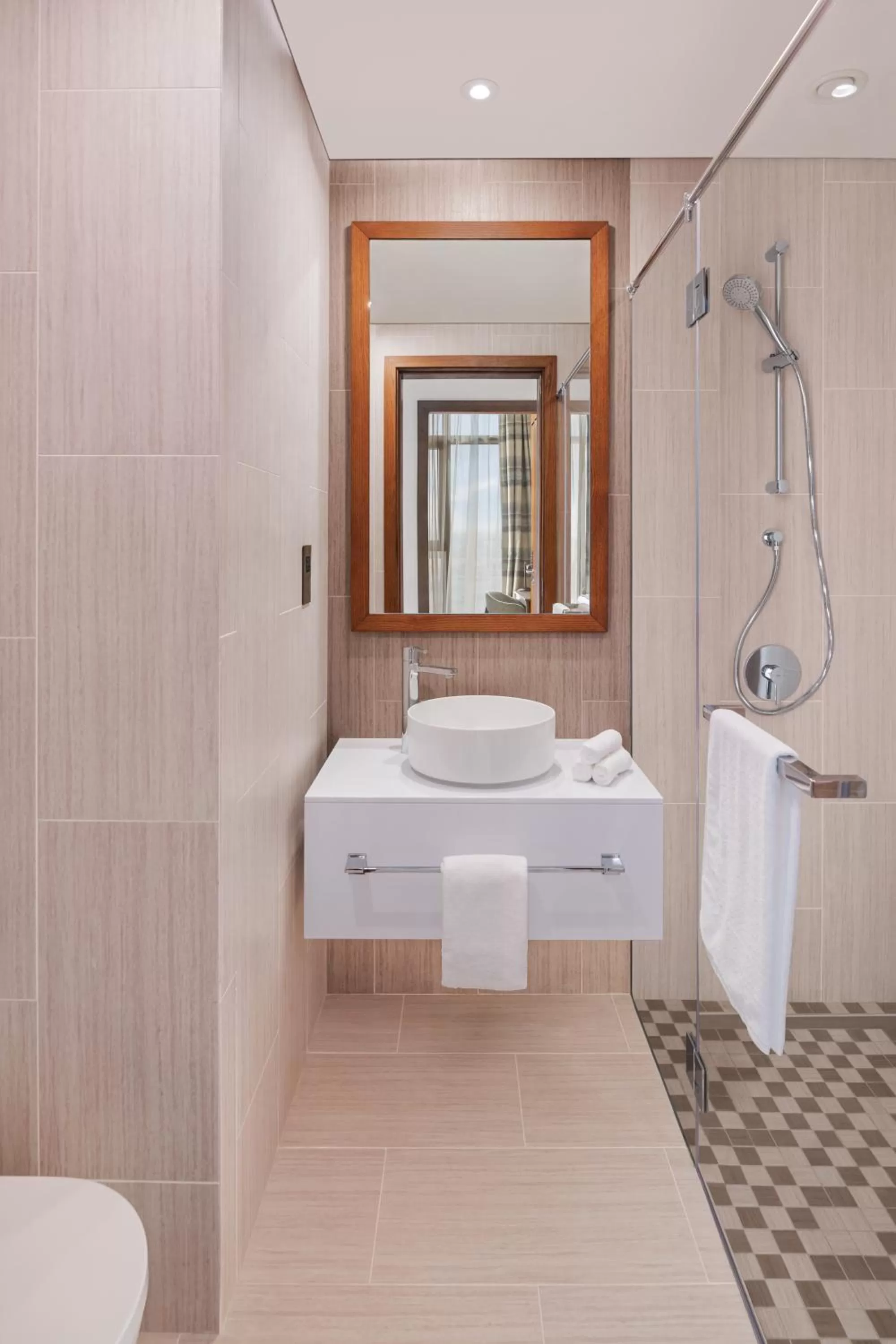 Bathroom in Staybridge Suites Dubai Al-Maktoum Airport by IHG