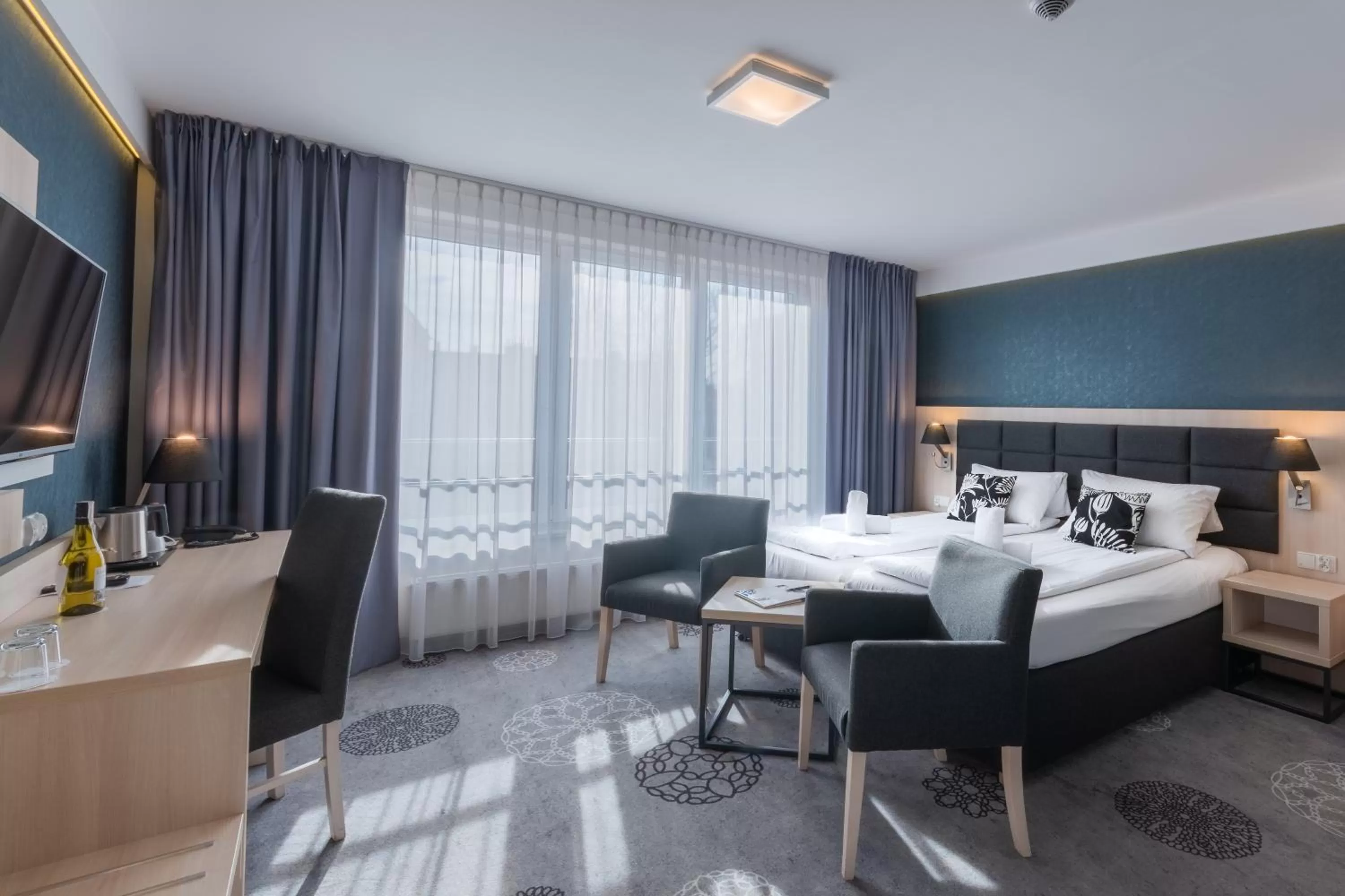 Bed in Hotel Lantier & Swimming Pool Zone