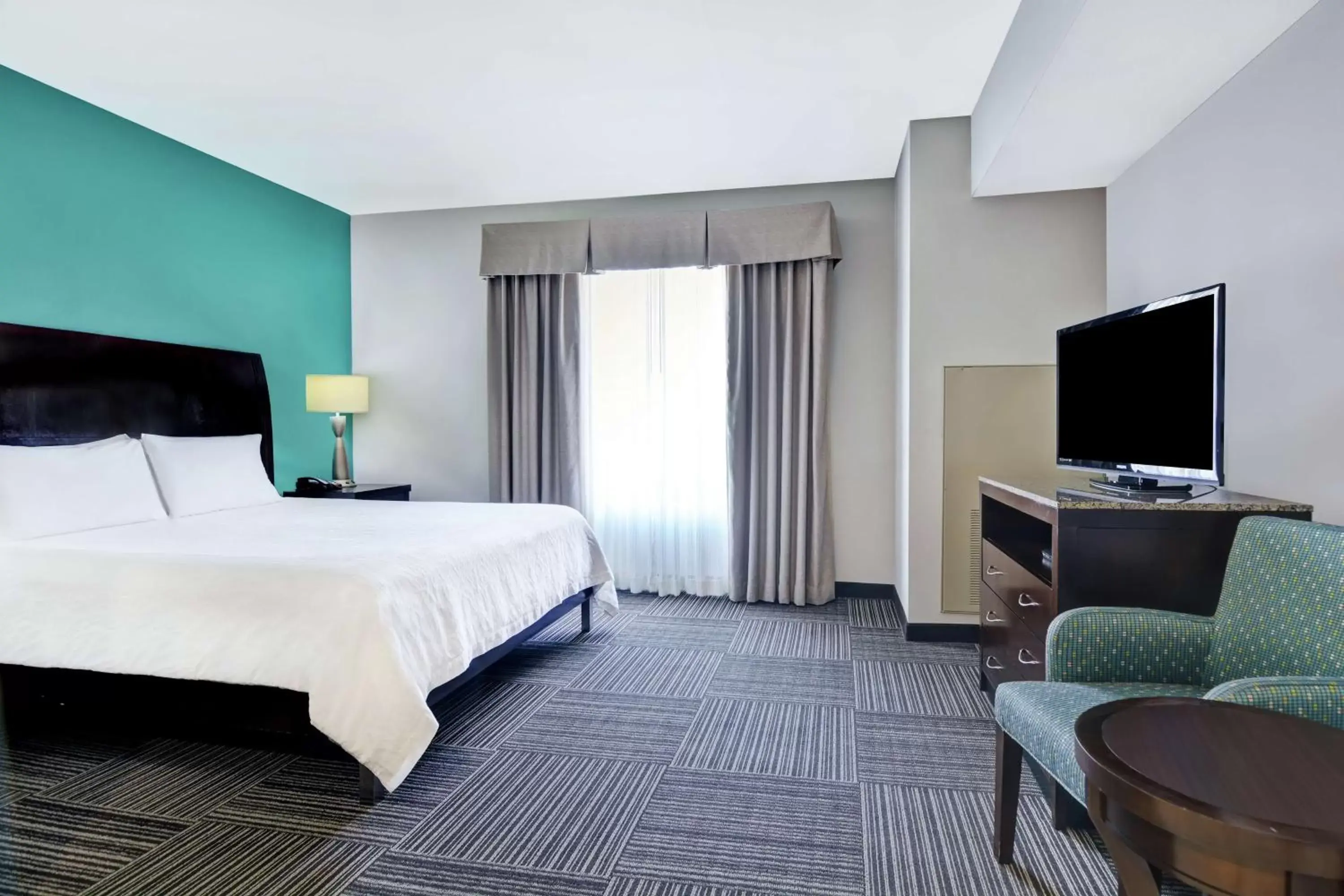 Bedroom, TV/Entertainment Center in Hilton Garden Inn and Fayetteville Convention Center