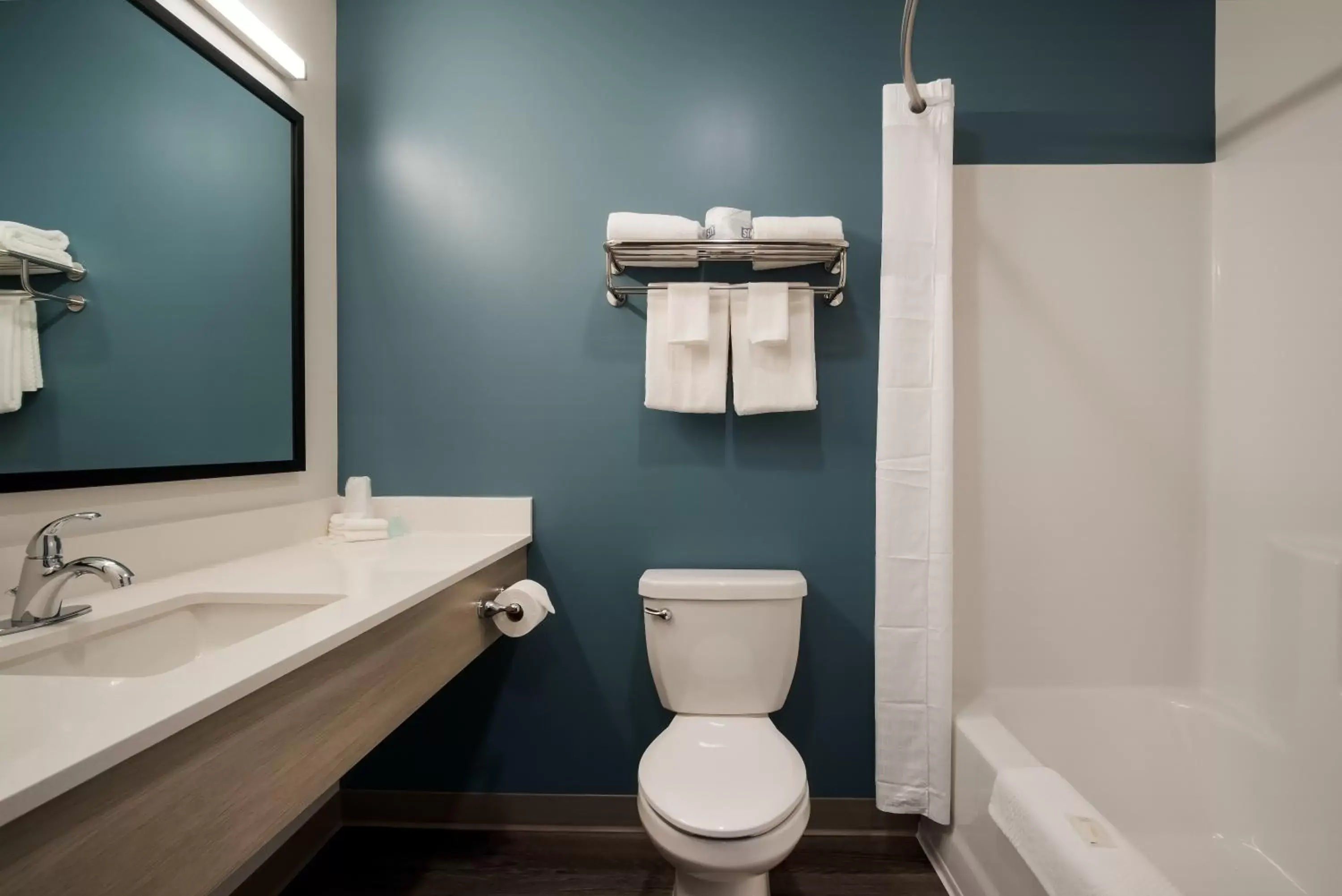 Bathroom in WoodSpring Suites Grand Rapids Kentwood