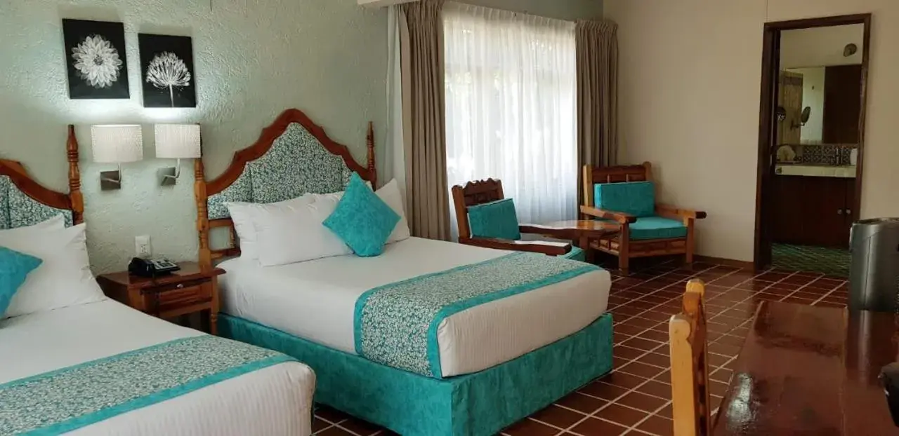 Photo of the whole room, Bed in Hotel Posada Quinta Las Flores