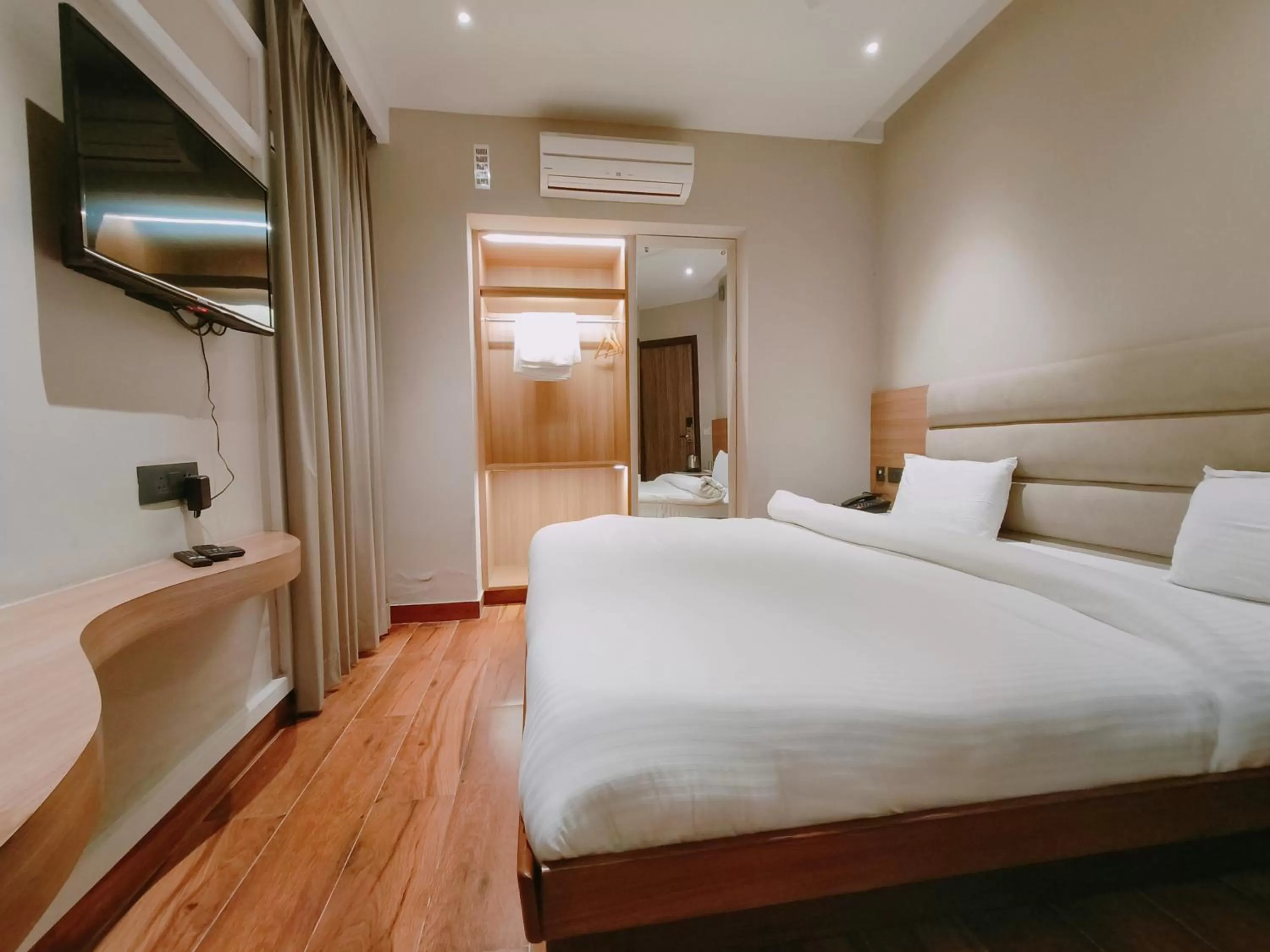 Bed in Aura Rooms
