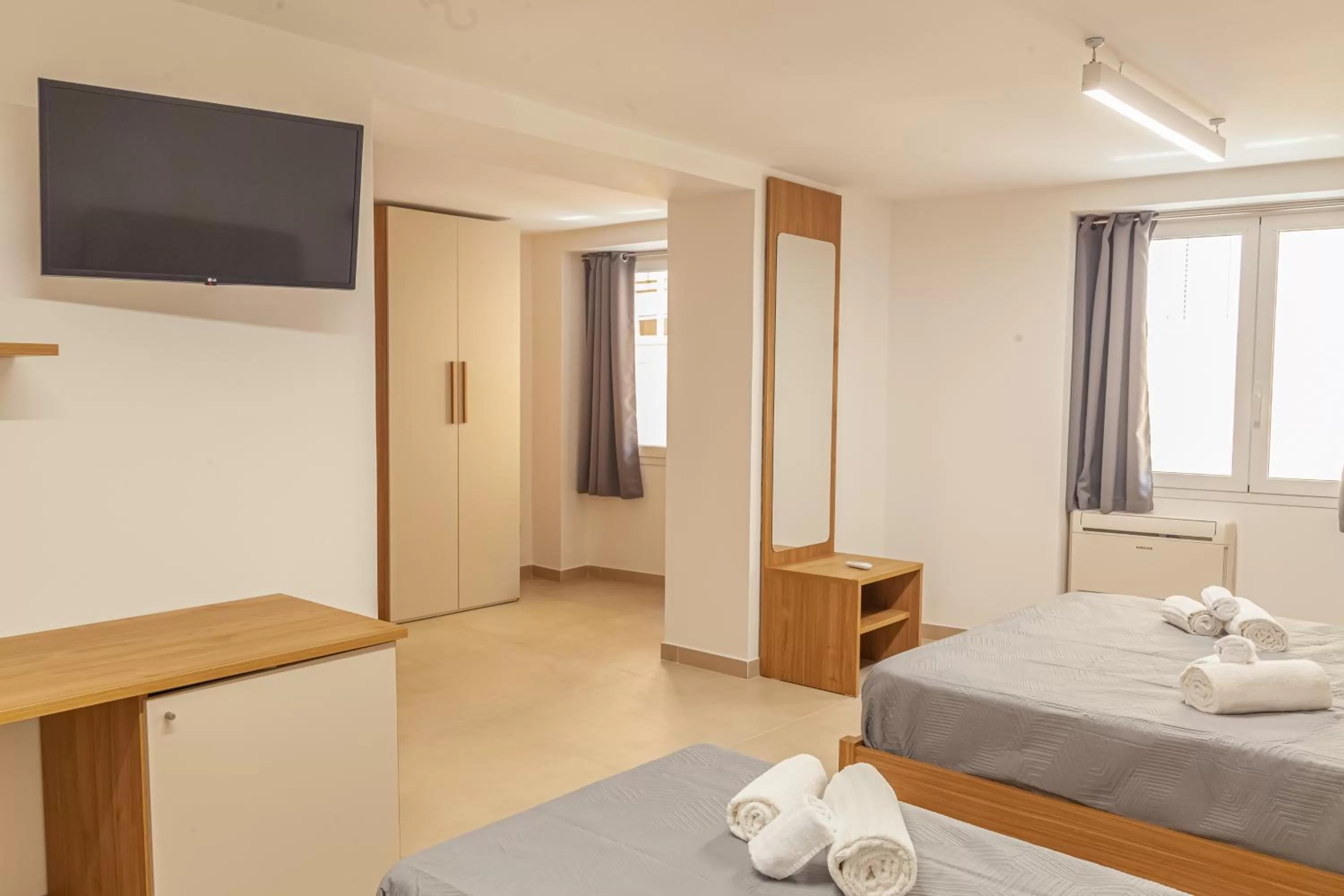 Photo of the whole room, TV/Entertainment Center in Isgrò Rooms