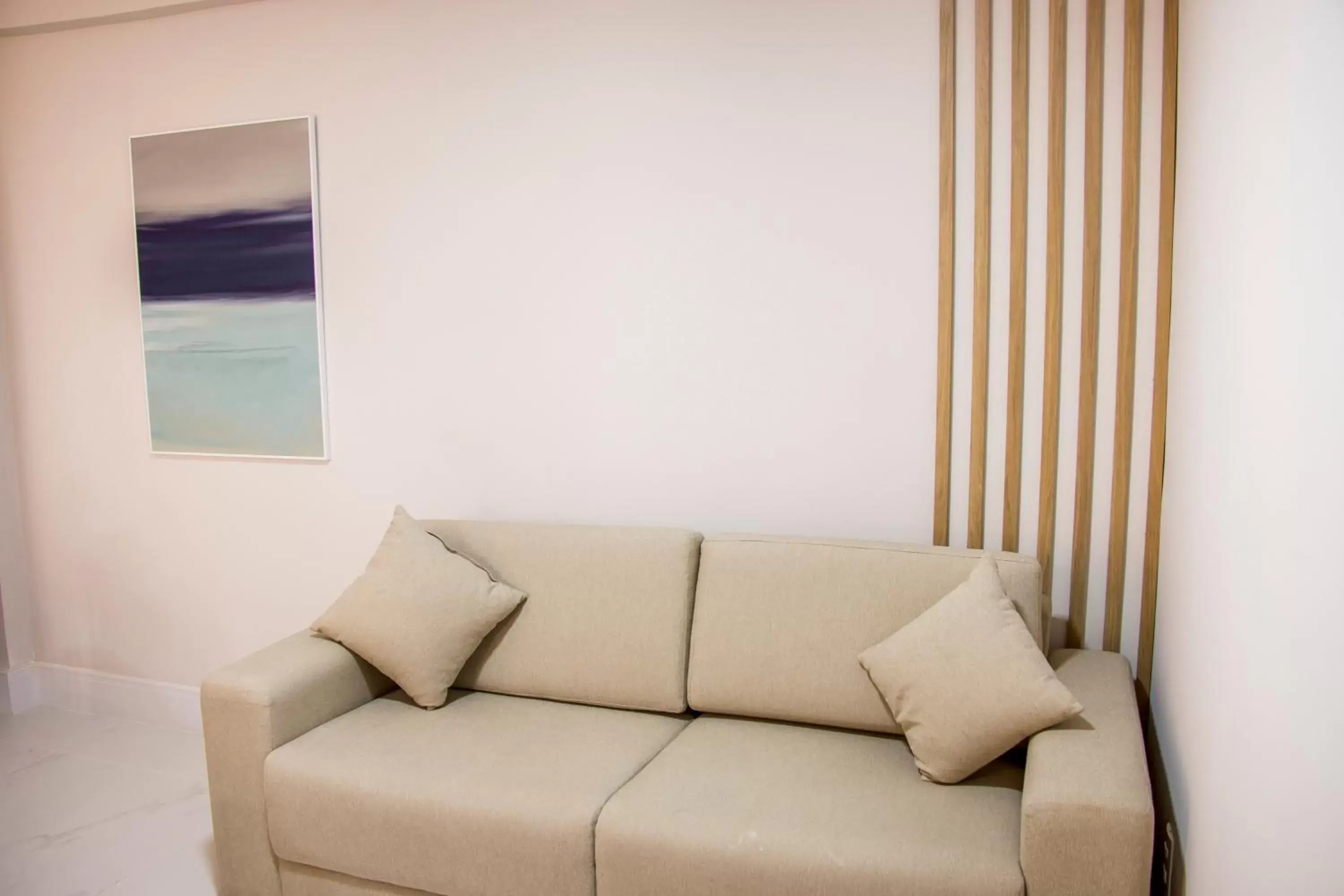 Living room, Seating Area in Ramada Hotel & Suites Campos Pelinca