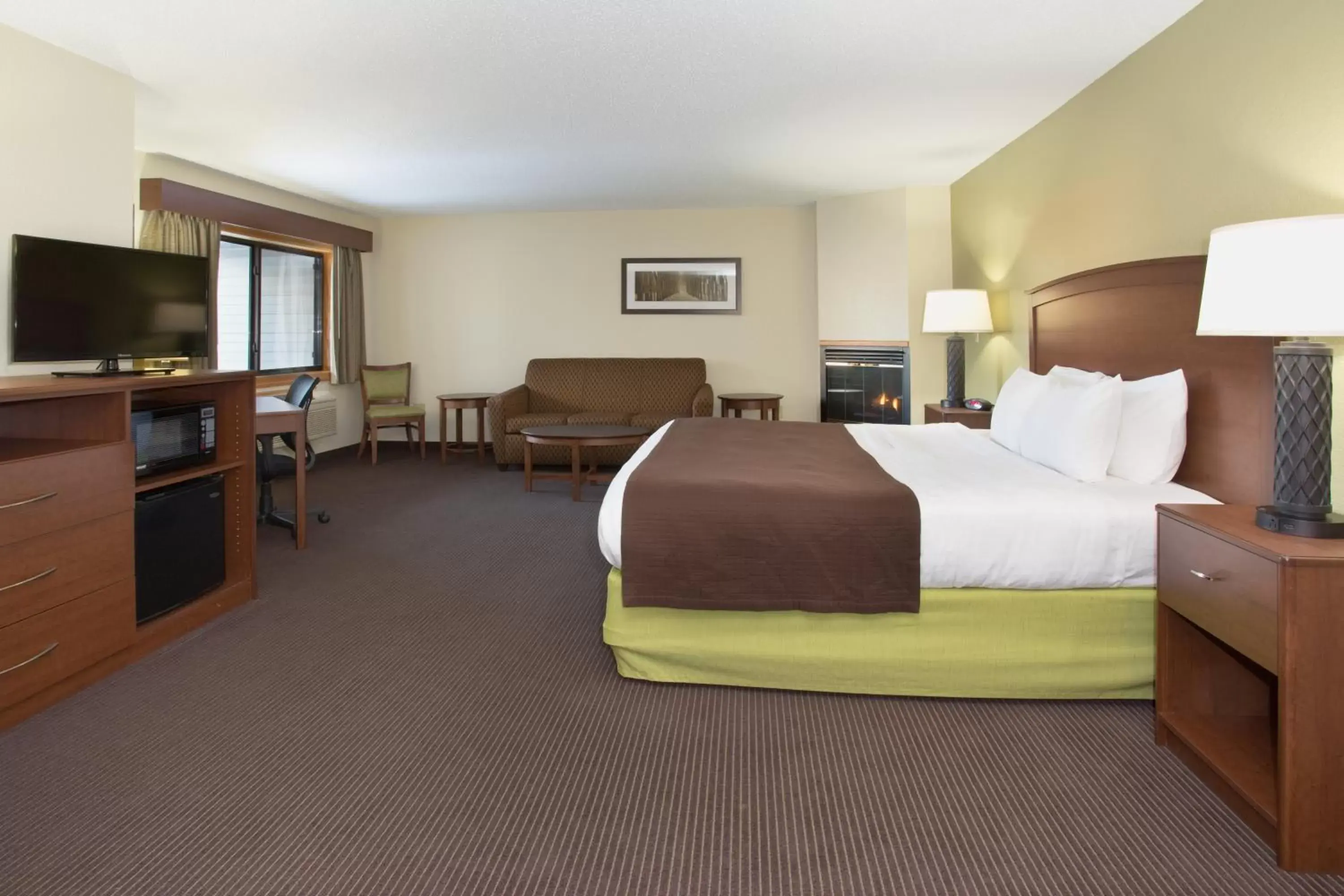 Bed in Cobblestone Hotel & Suites - Wisconsin Rapids