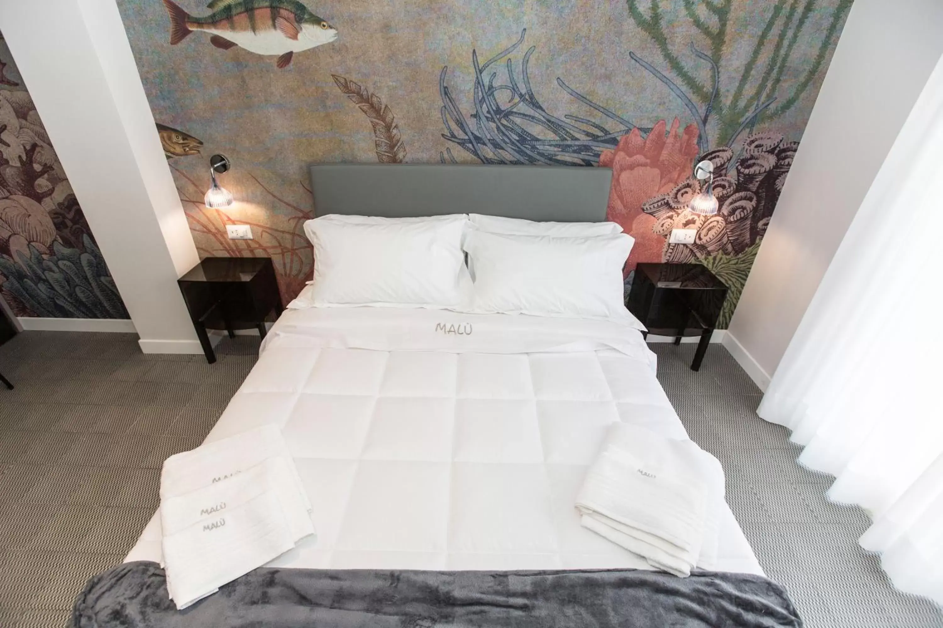 Bed in Malù Suites Bed in Malù Suites