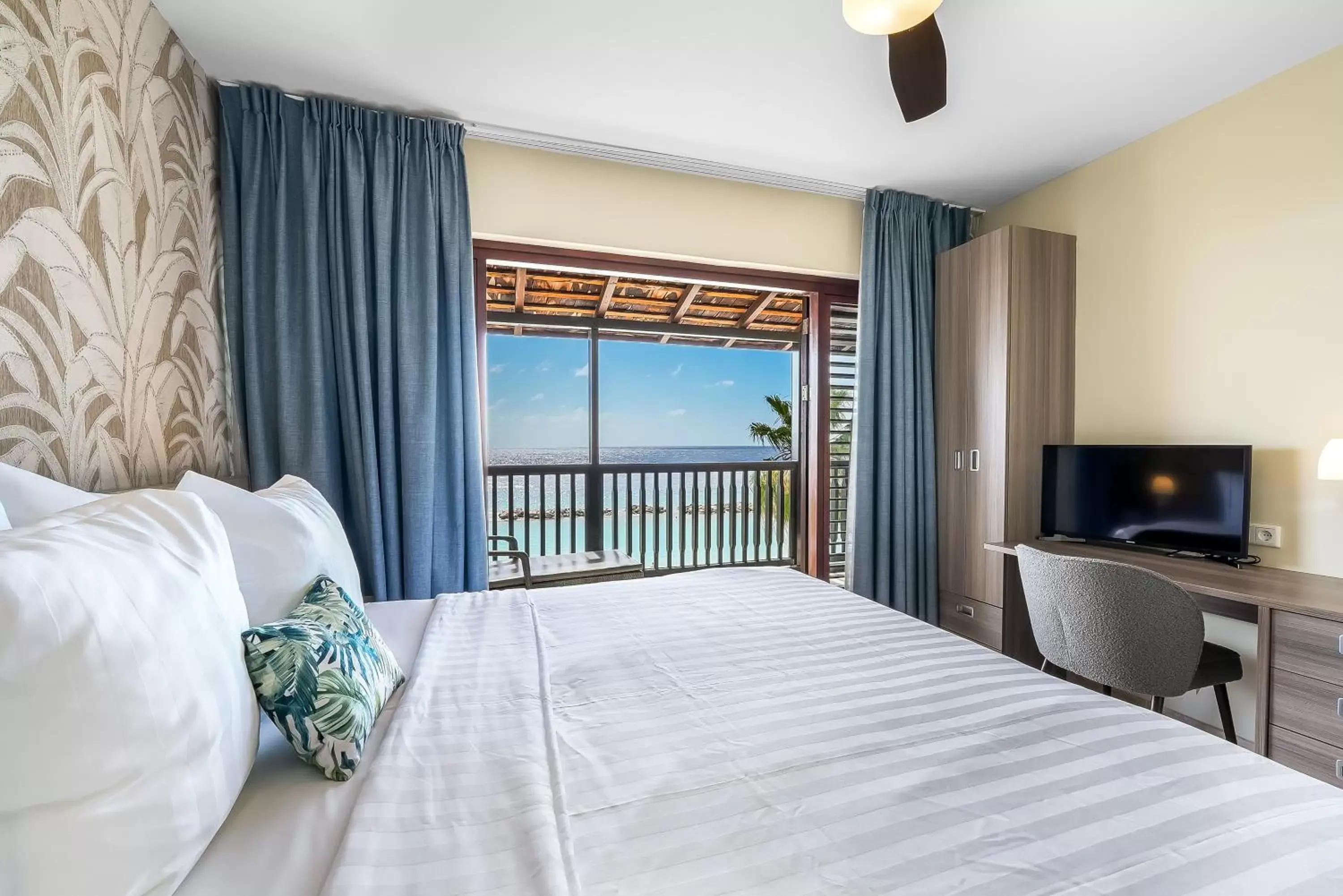 Bed in LionsDive Beach Resort