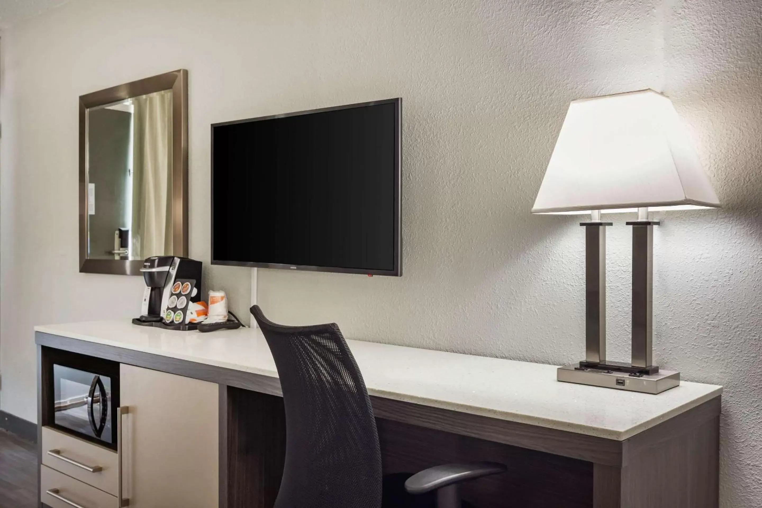 Photo of the whole room, TV/Entertainment Center in Quality Inn & Suites