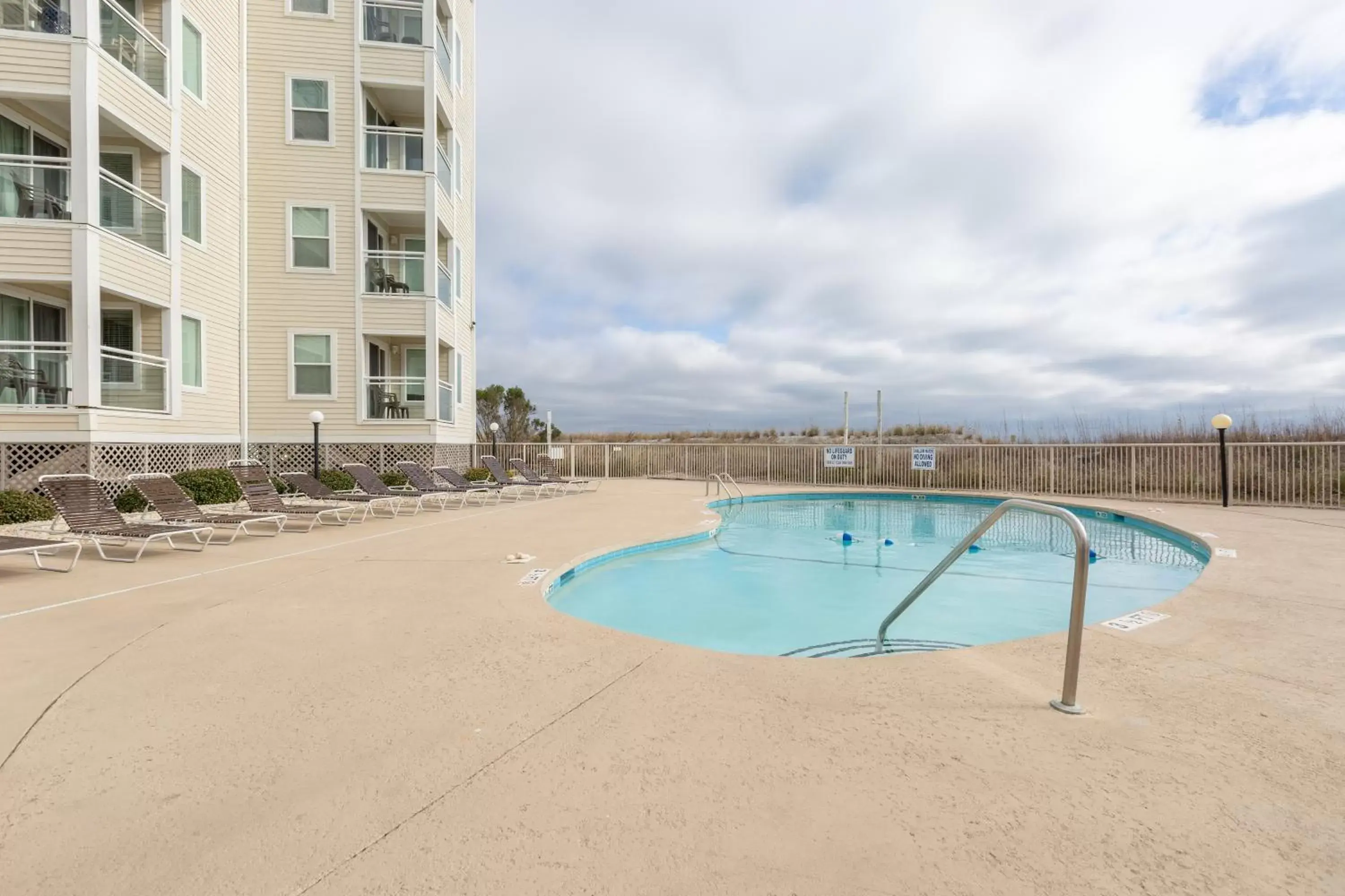 Swimming Pool in A Place at the Beach by Capital Vacations