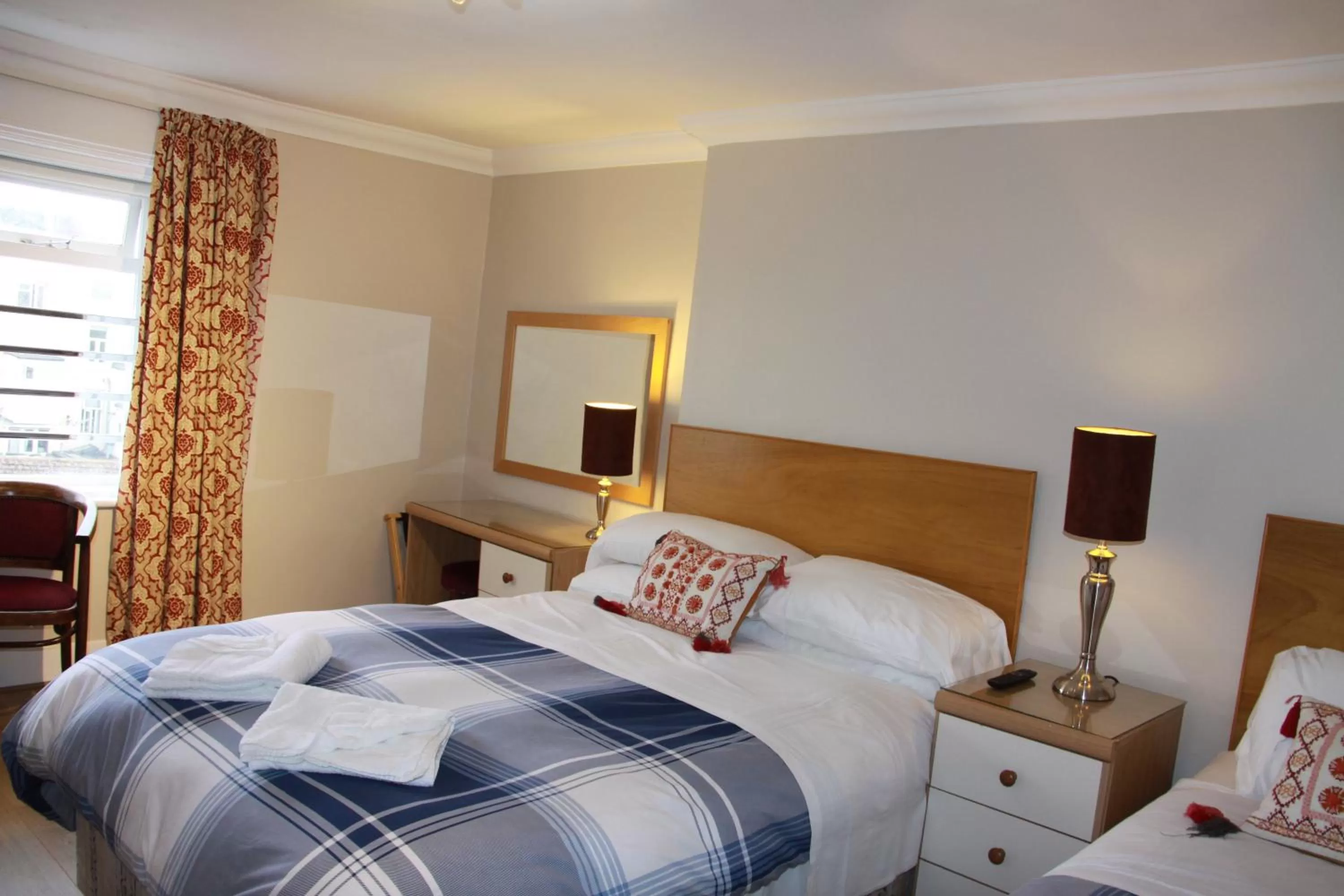 Bed in Ambassador Hotel