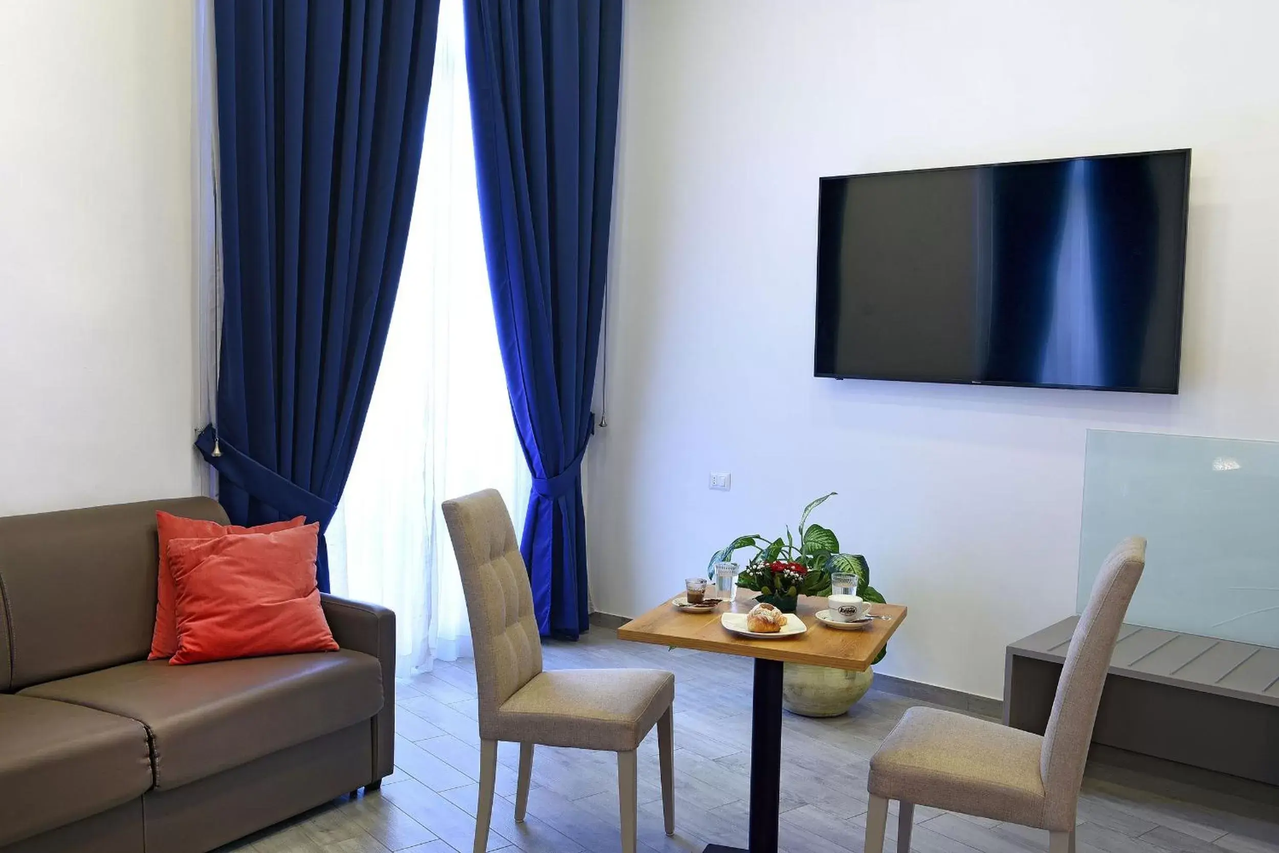 Seating area, TV/Entertainment Center in Barbarella HOTEL SPA