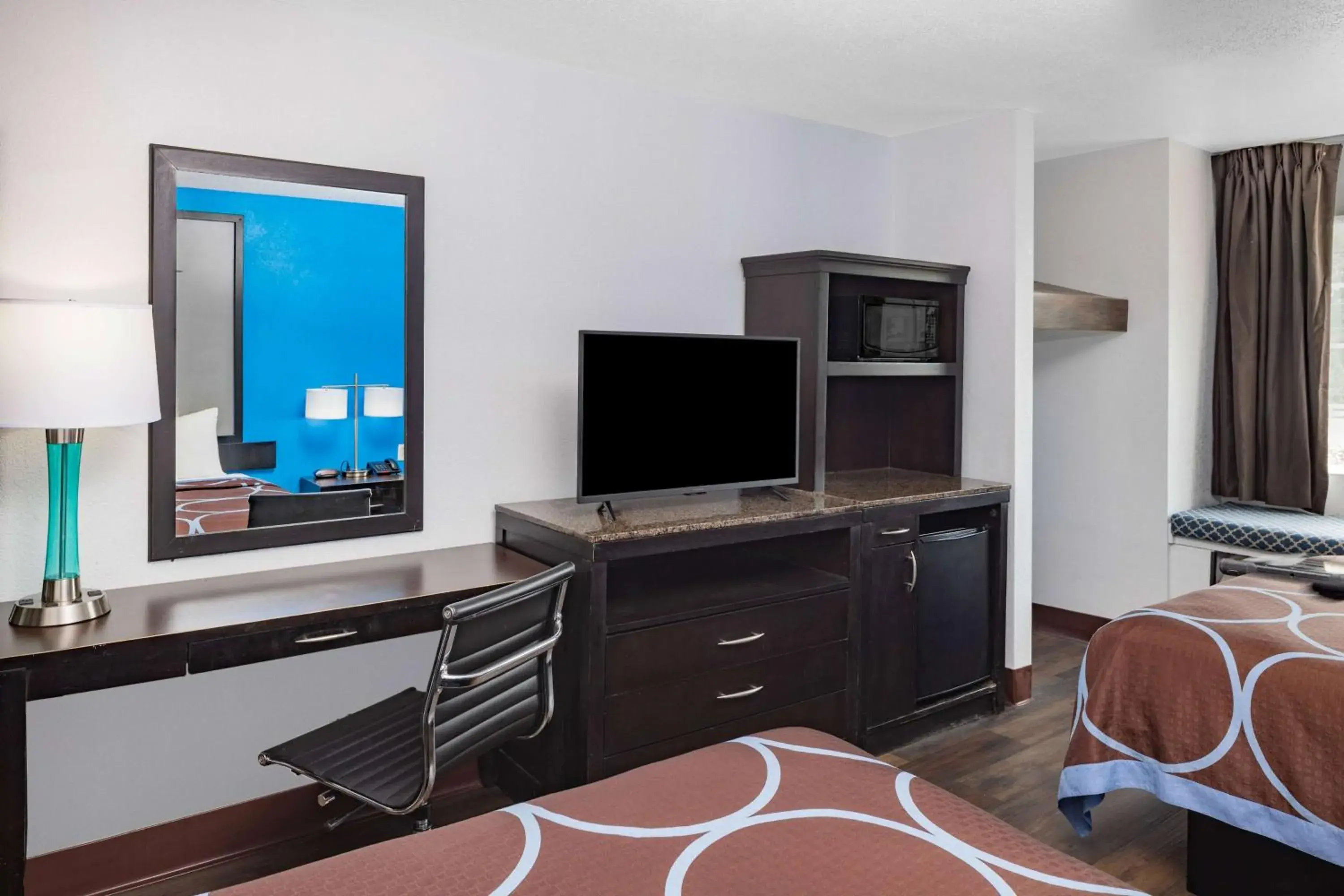 Photo of the whole room, TV/Entertainment Center in Super 8 by Wyndham Pensacola