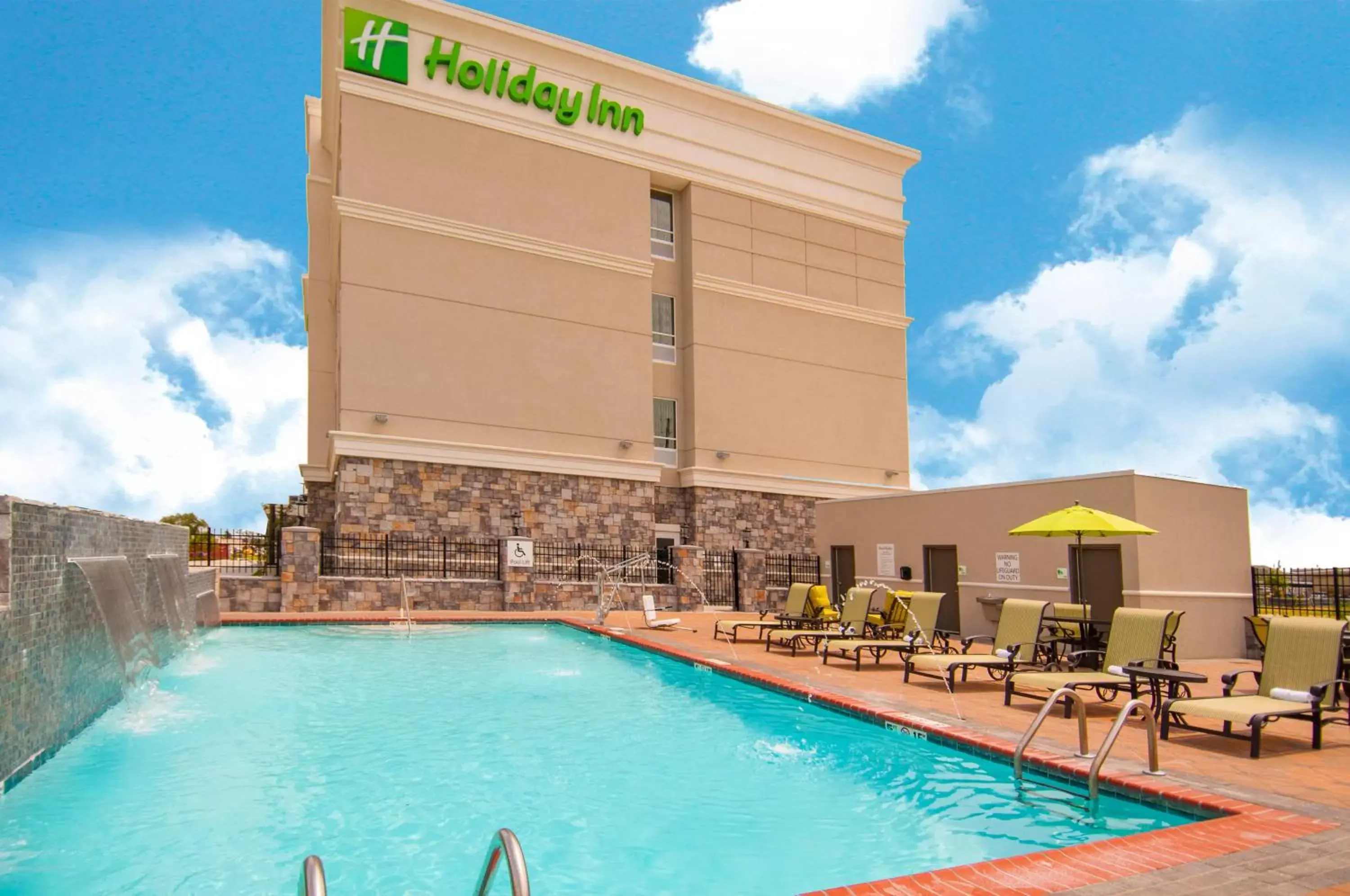 Swimming pool, Property Building in Holiday Inn - New Orleans Airport North, an IHG Hotel