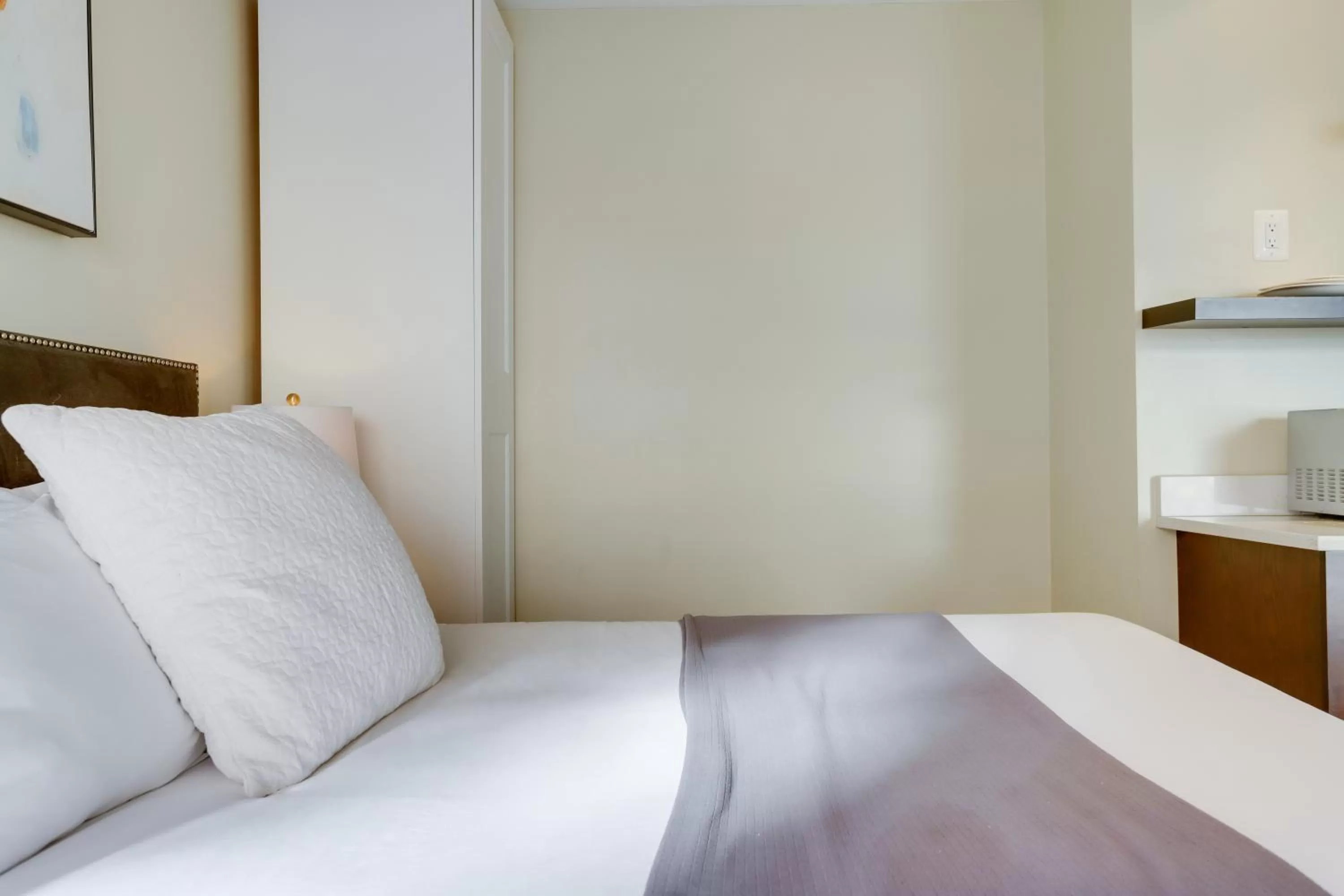 Bed in Sojourn at DuPont Place