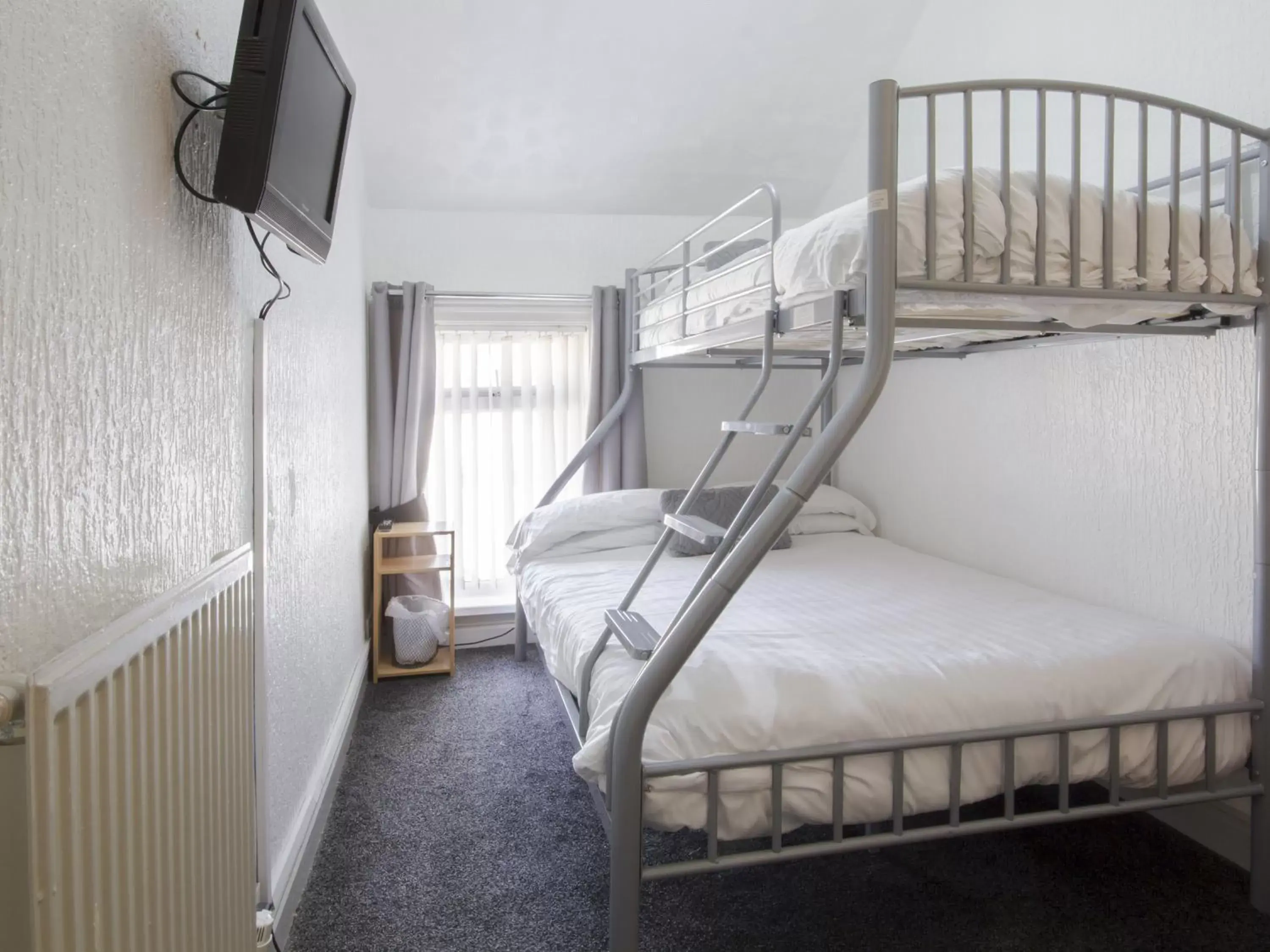 Bedroom in The Marsden Hotel