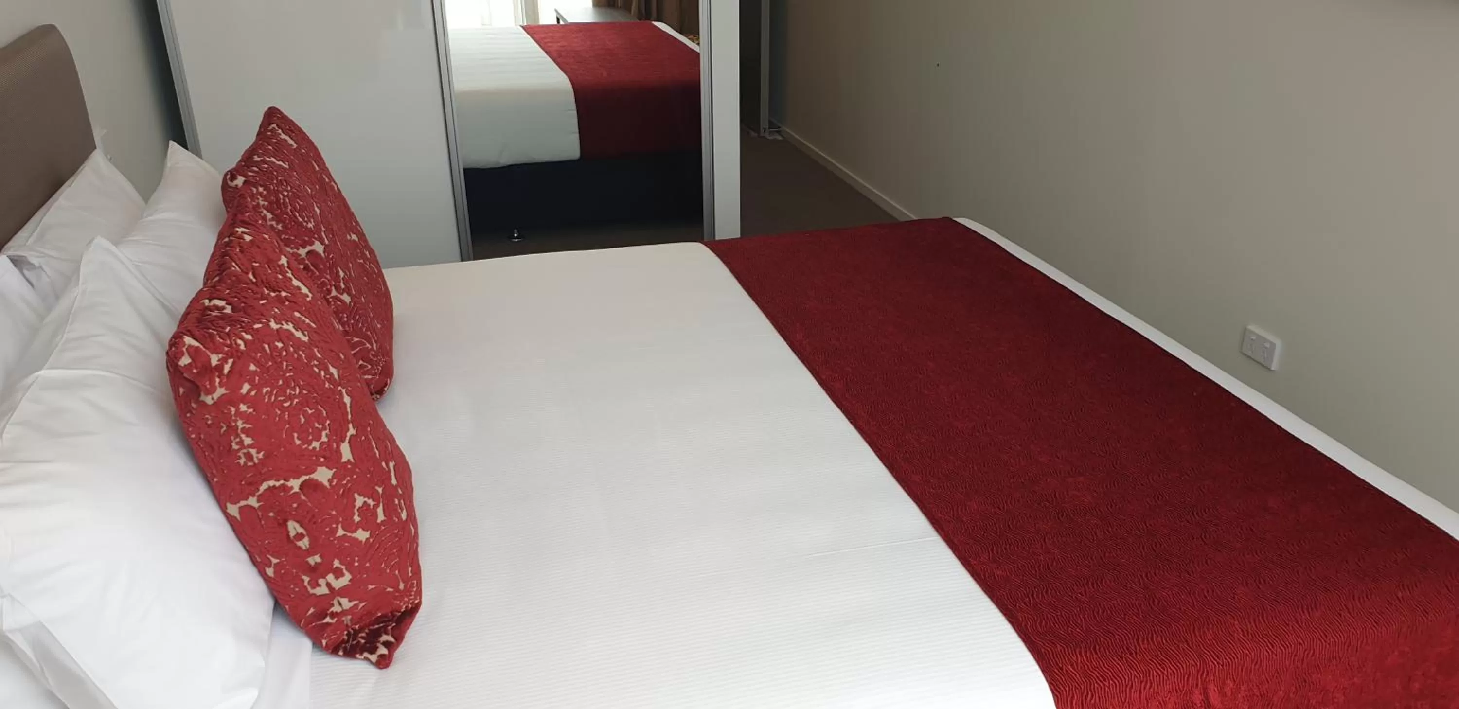 Bed in Ramada Suites by Wyndham Auckland Manukau Pacfic Centre