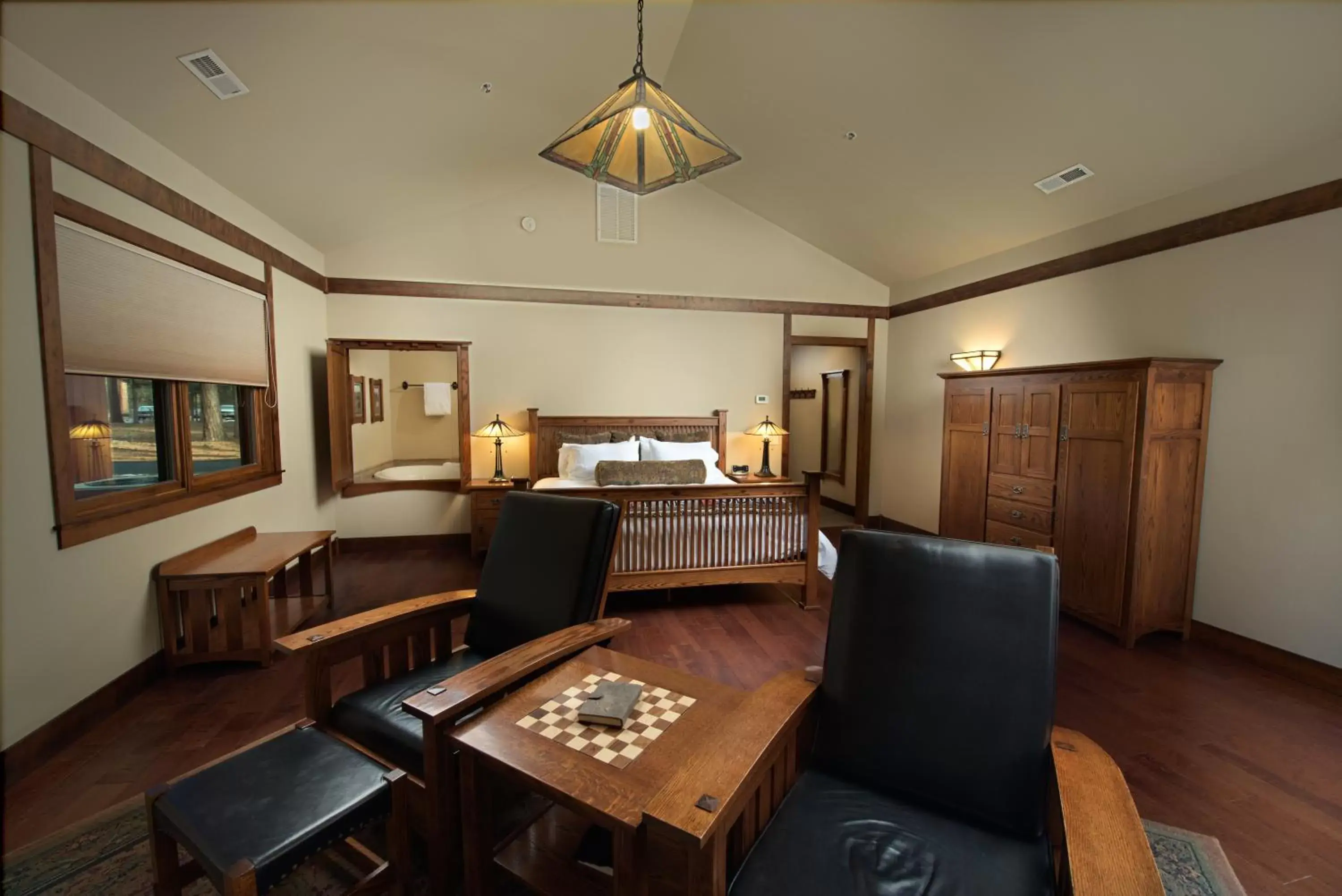 Bed, Seating Area in FivePine Lodge