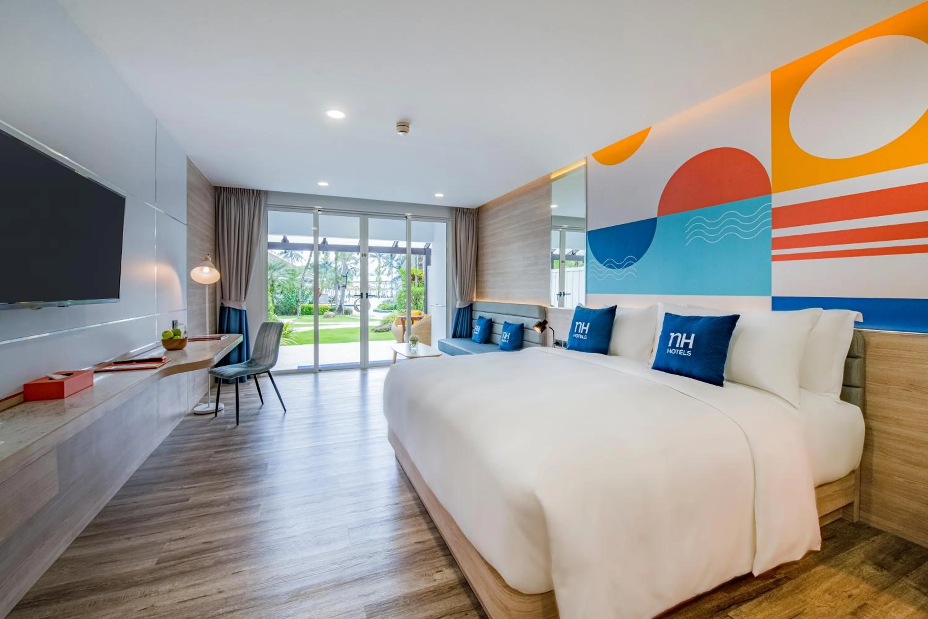 Bed in NH Boat Lagoon Phuket Resort