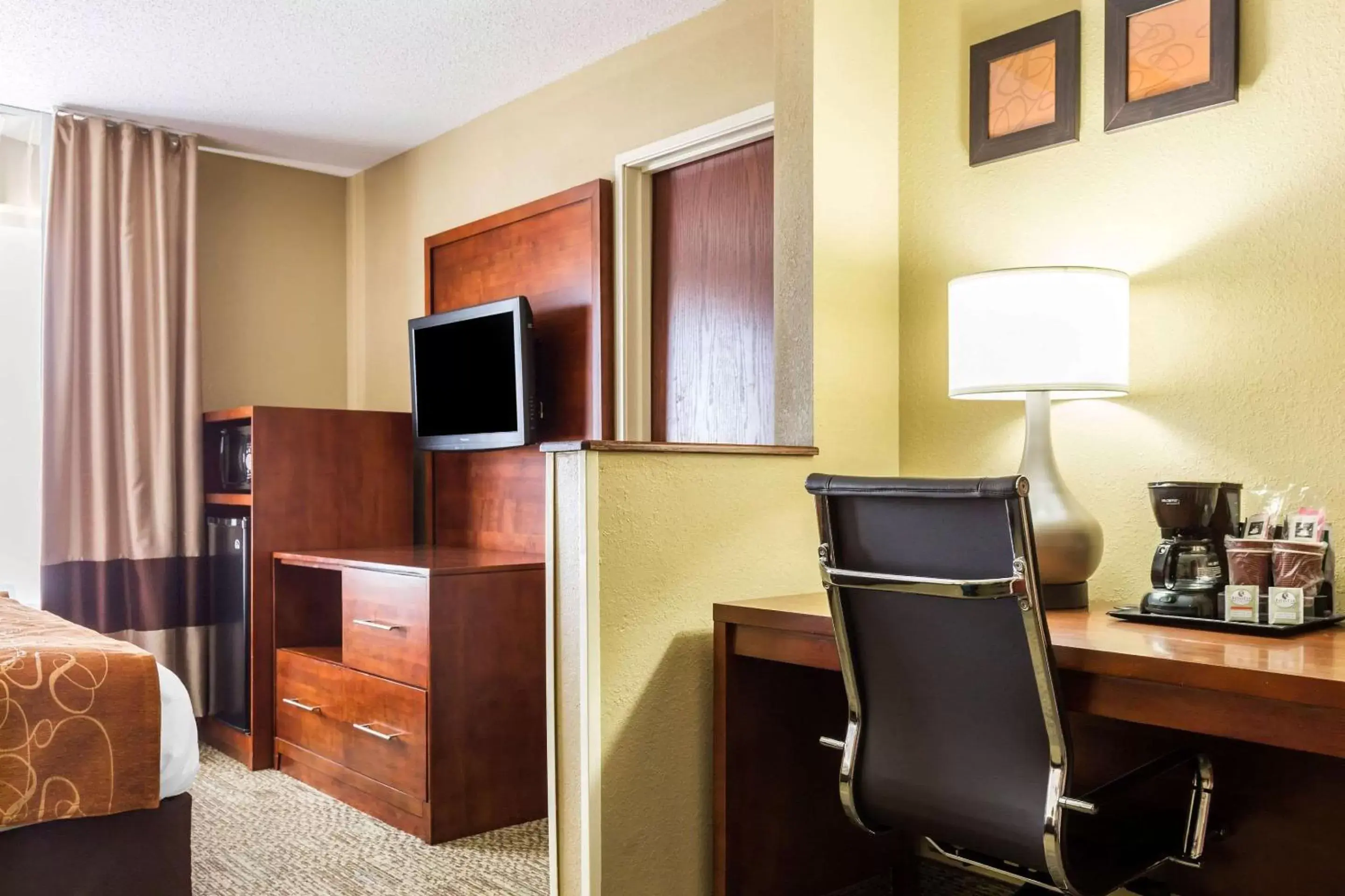 Photo of the whole room, TV/Entertainment Center in Comfort Suites near I-80 and I-94