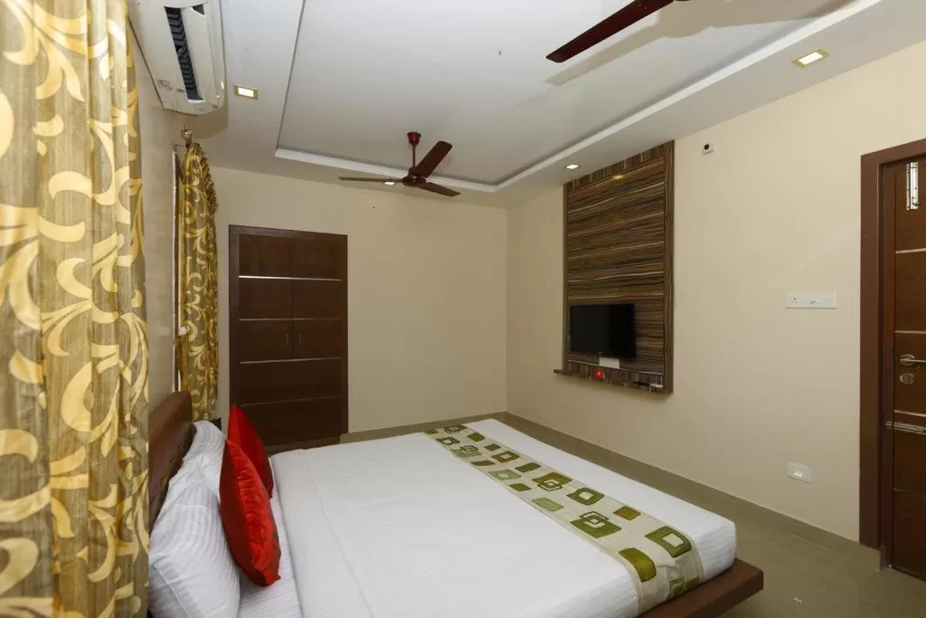 Photo of the whole room, Bed in Sri Kamadhenu Residency
