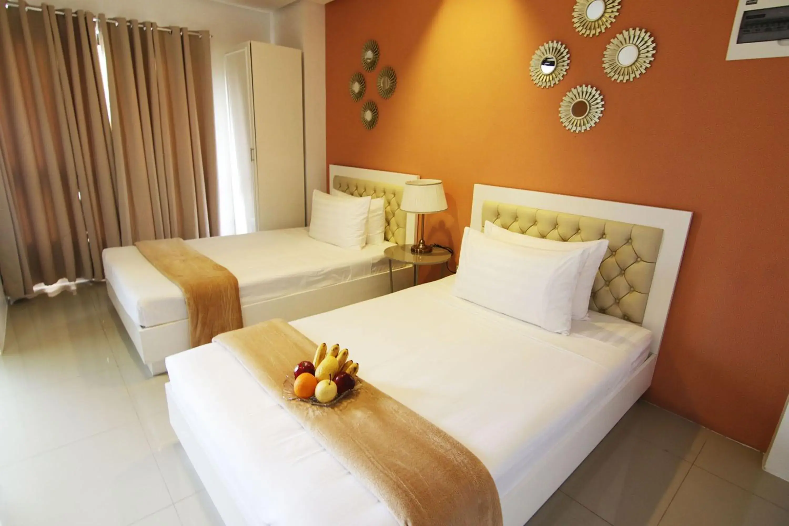 Bed in Baymont Suites and Residences