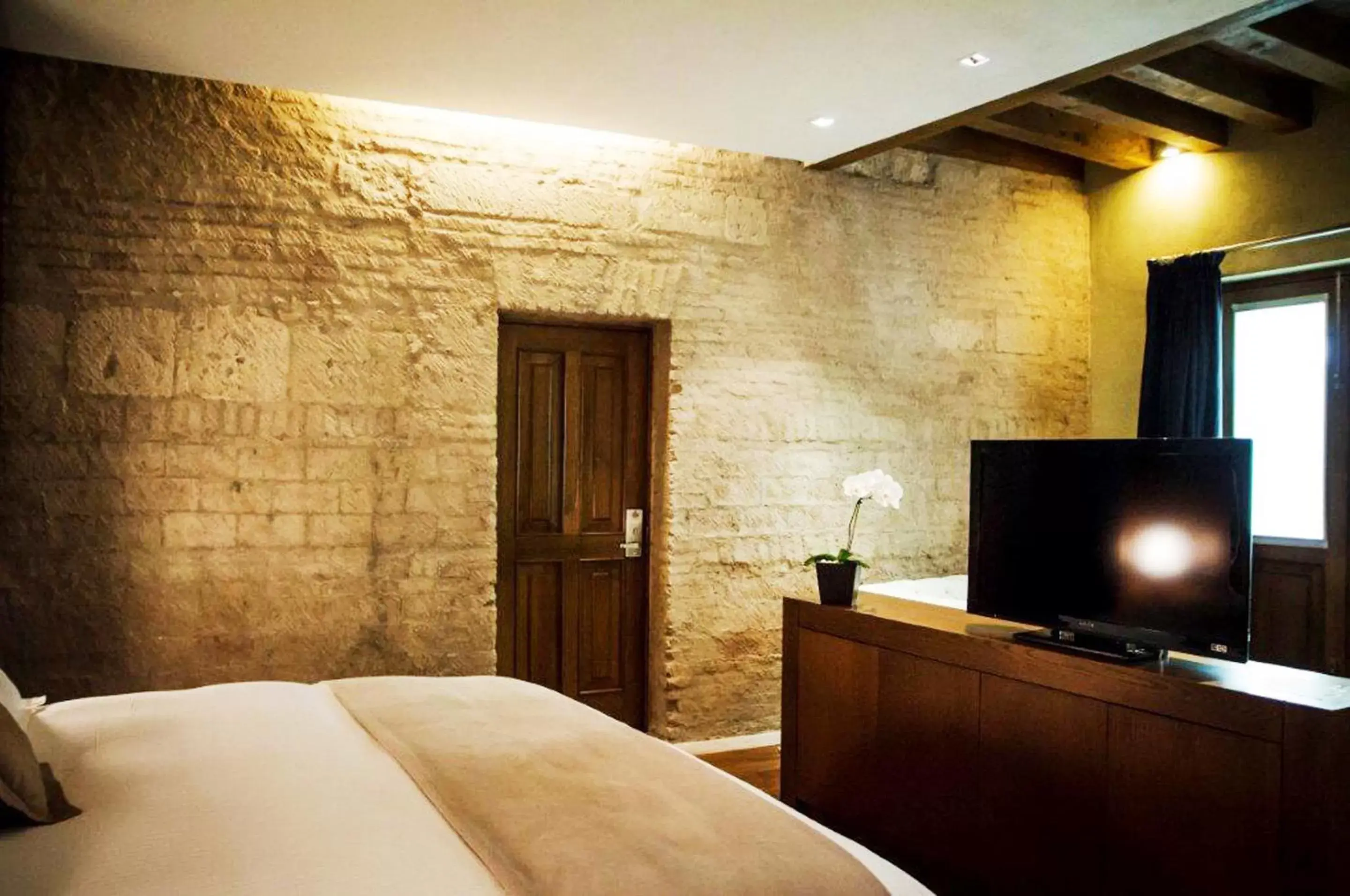 Bed, TV/Entertainment Center in Hotel Boutique Casa Madero