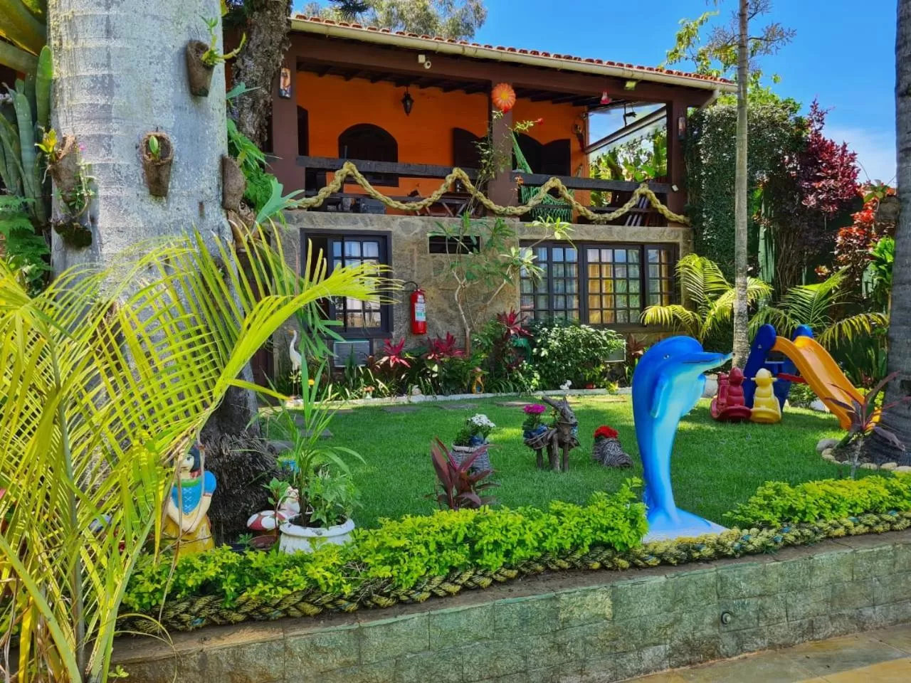Swimming pool in Suítes Casa do Barão