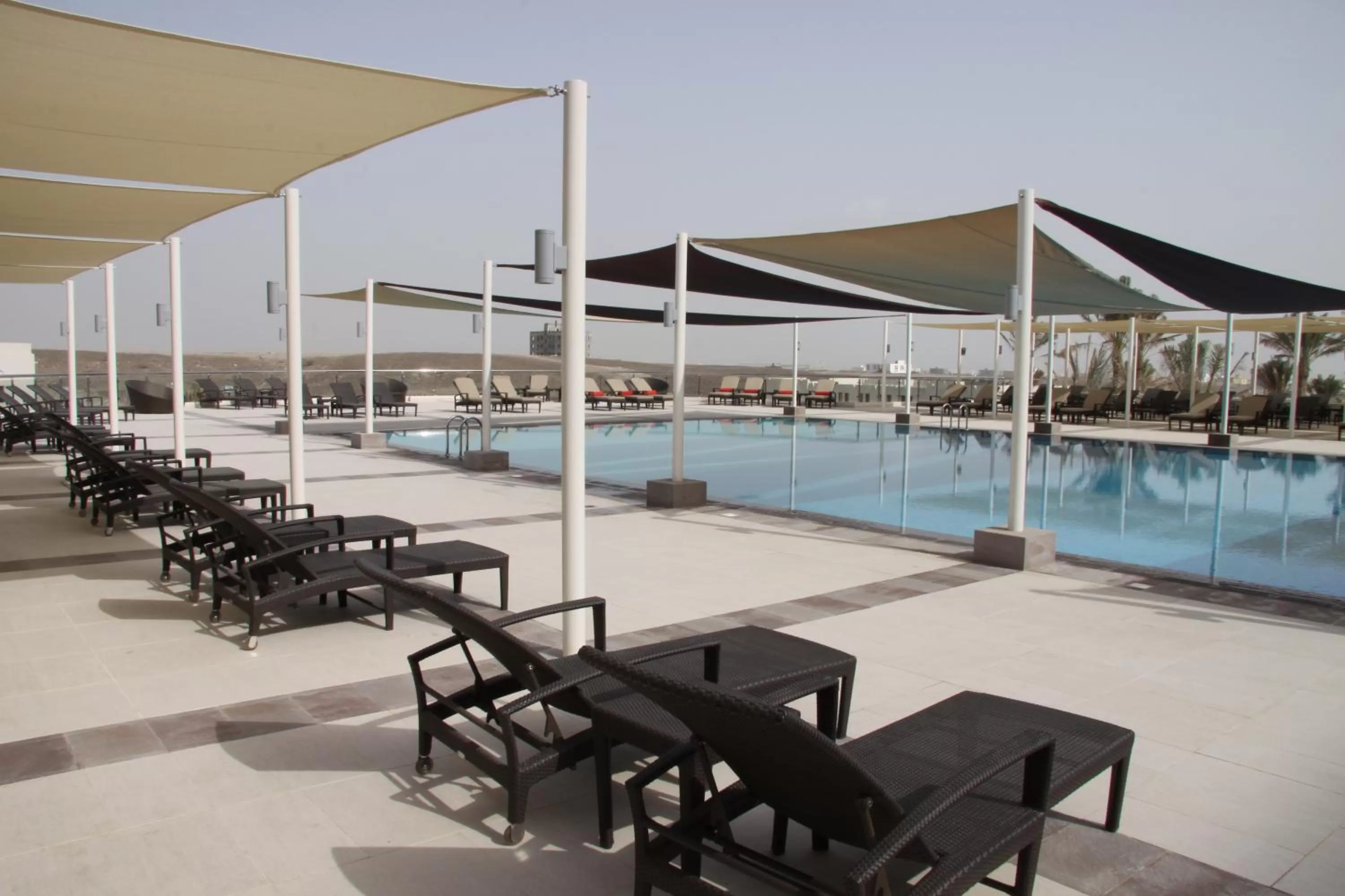 Swimming pool in Crowne Plaza Sohar by IHG