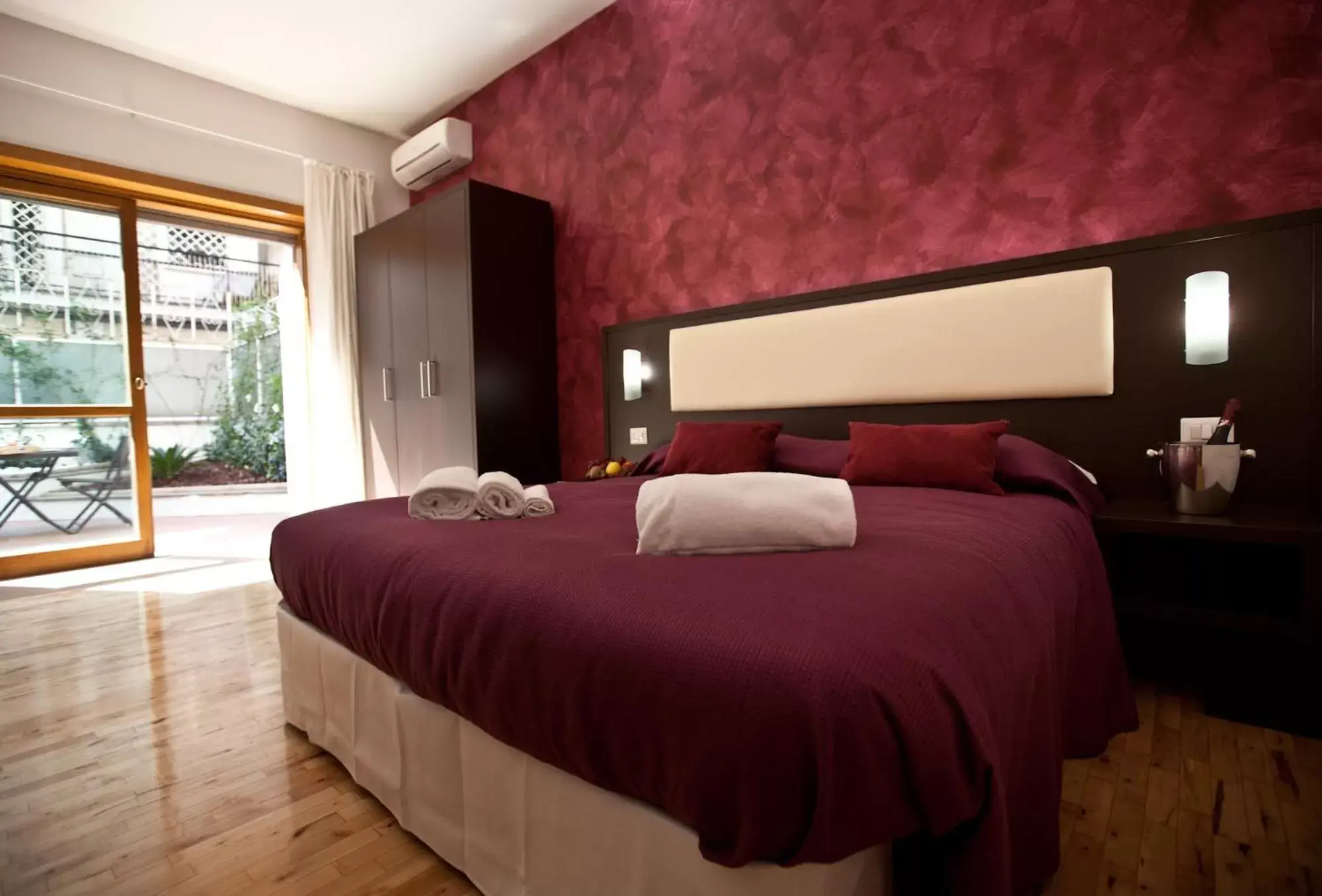 Bed in Heart of Rome Rooms