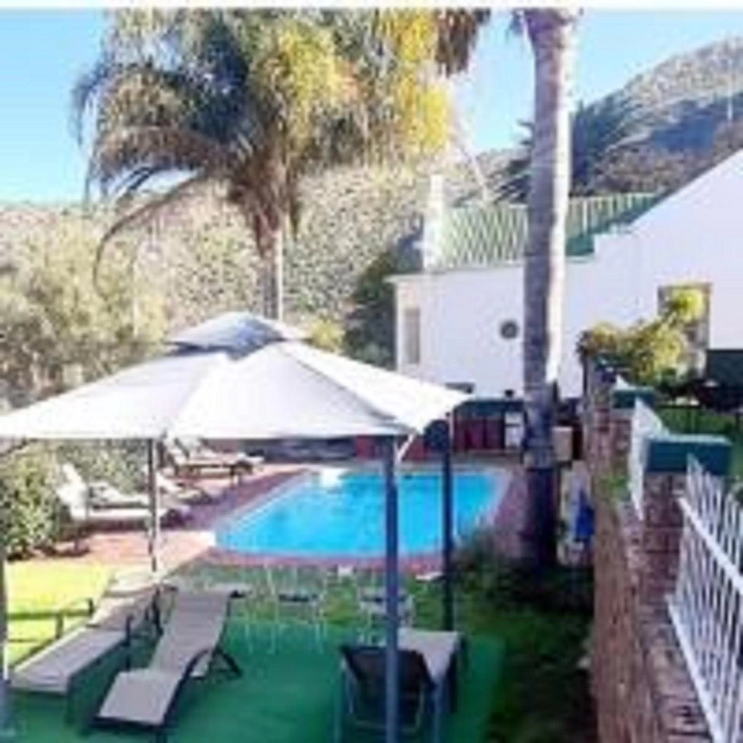 King Room with Pool View in Old Mill Lodge, Seasonal Working Ostrich Farm & Restaurant, Oudtshoorn