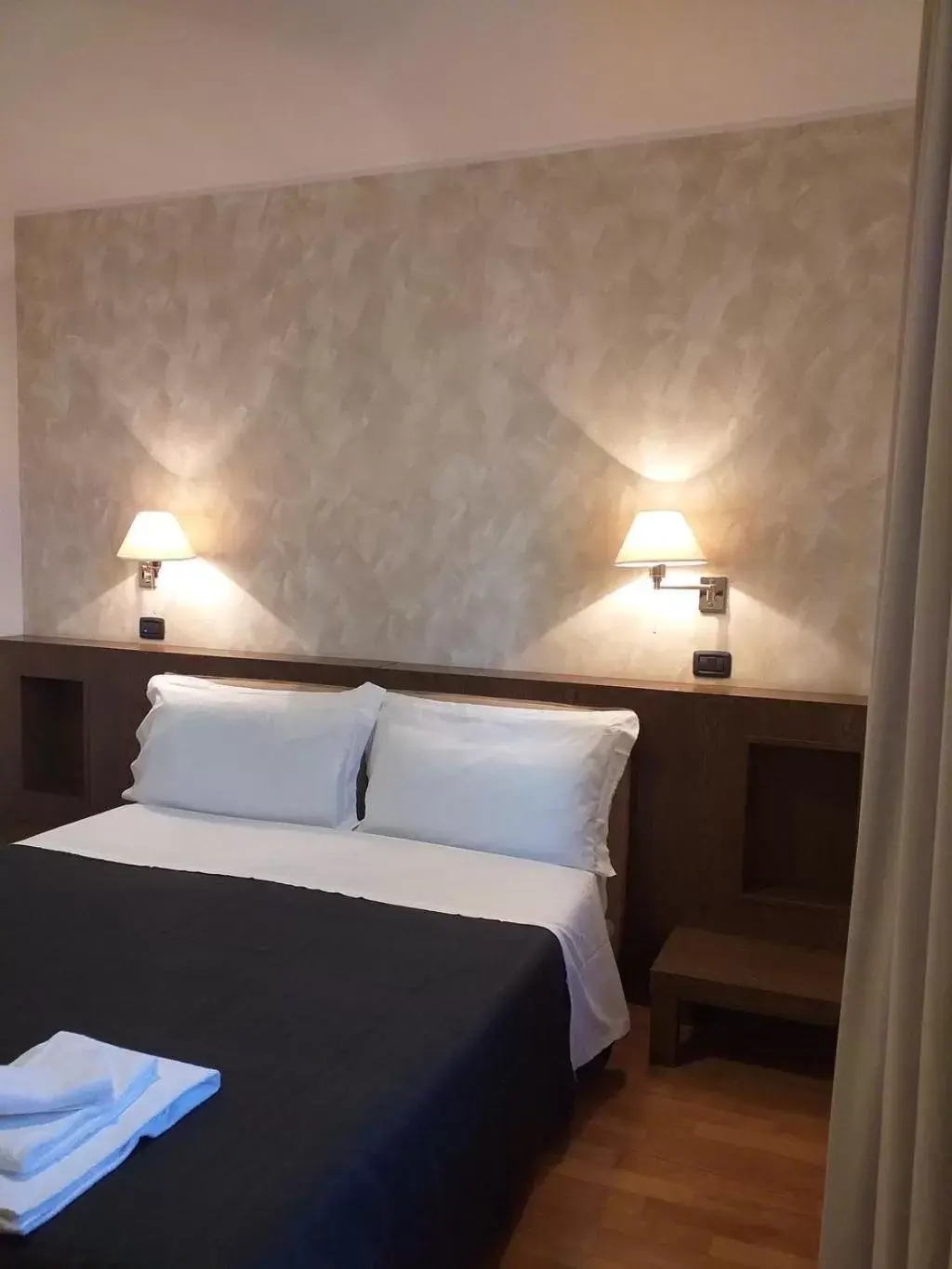 Bed in HOTEL CAVALIERI