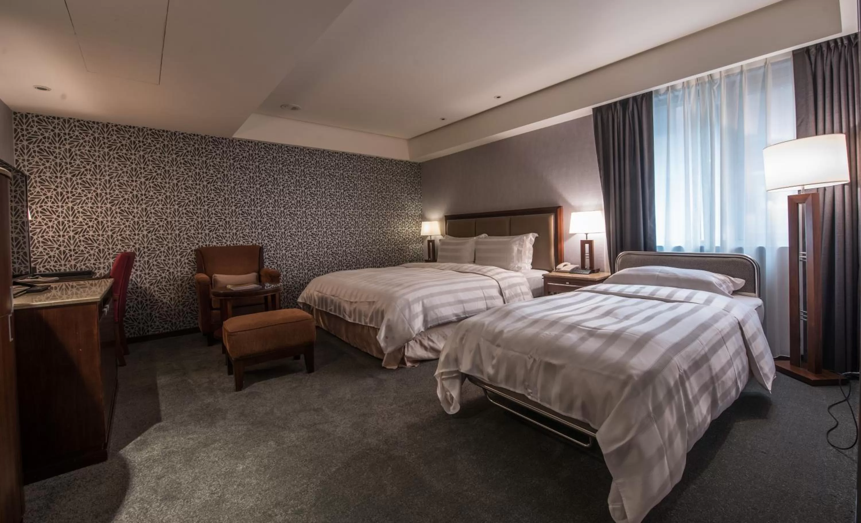 Bed in Royal Biz Taipei Hotel