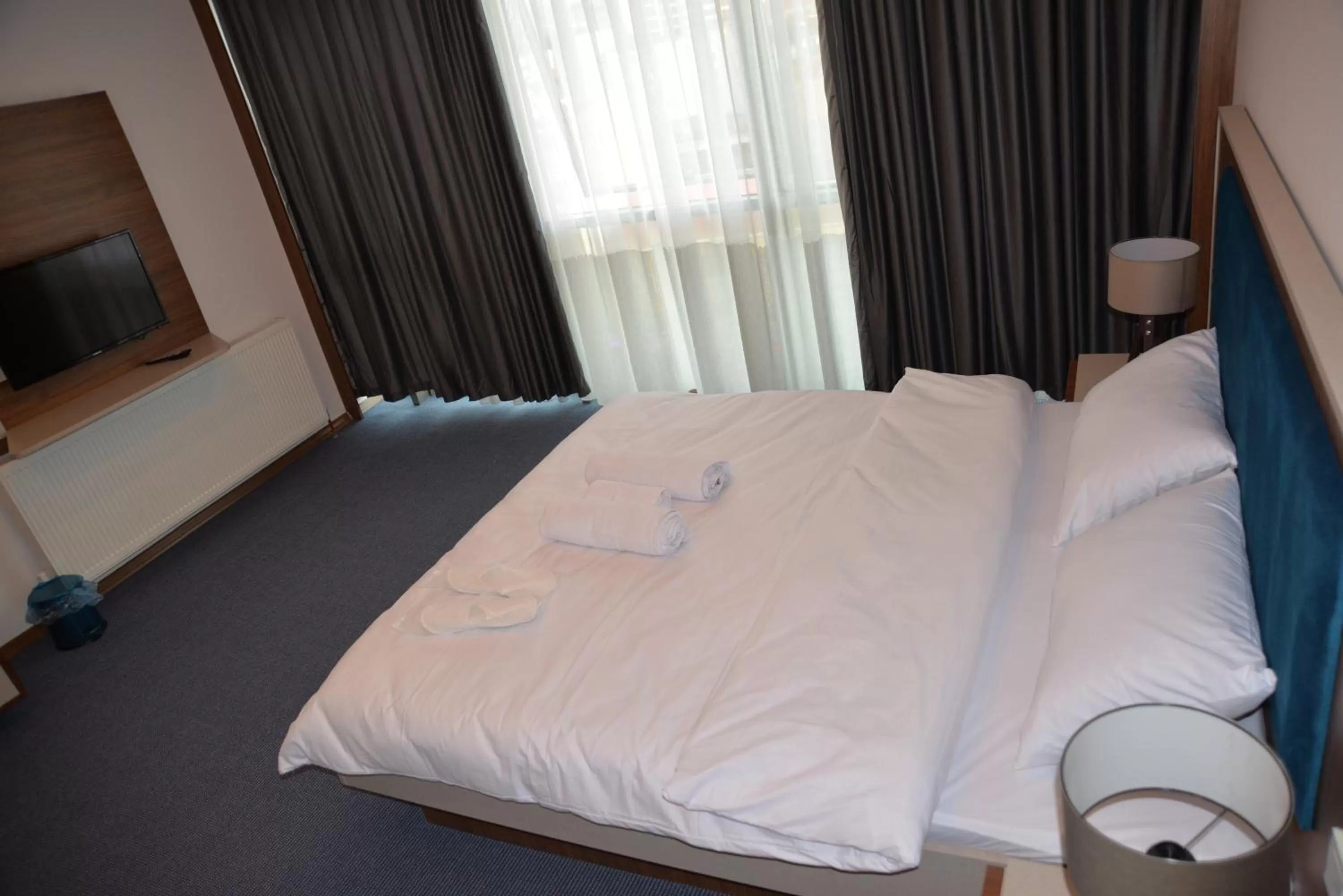 Bed in TEVETOGLU HOTEL