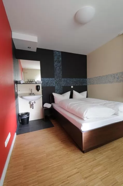 Photo of the whole room, Bed in HOLI-Berlin Hotel