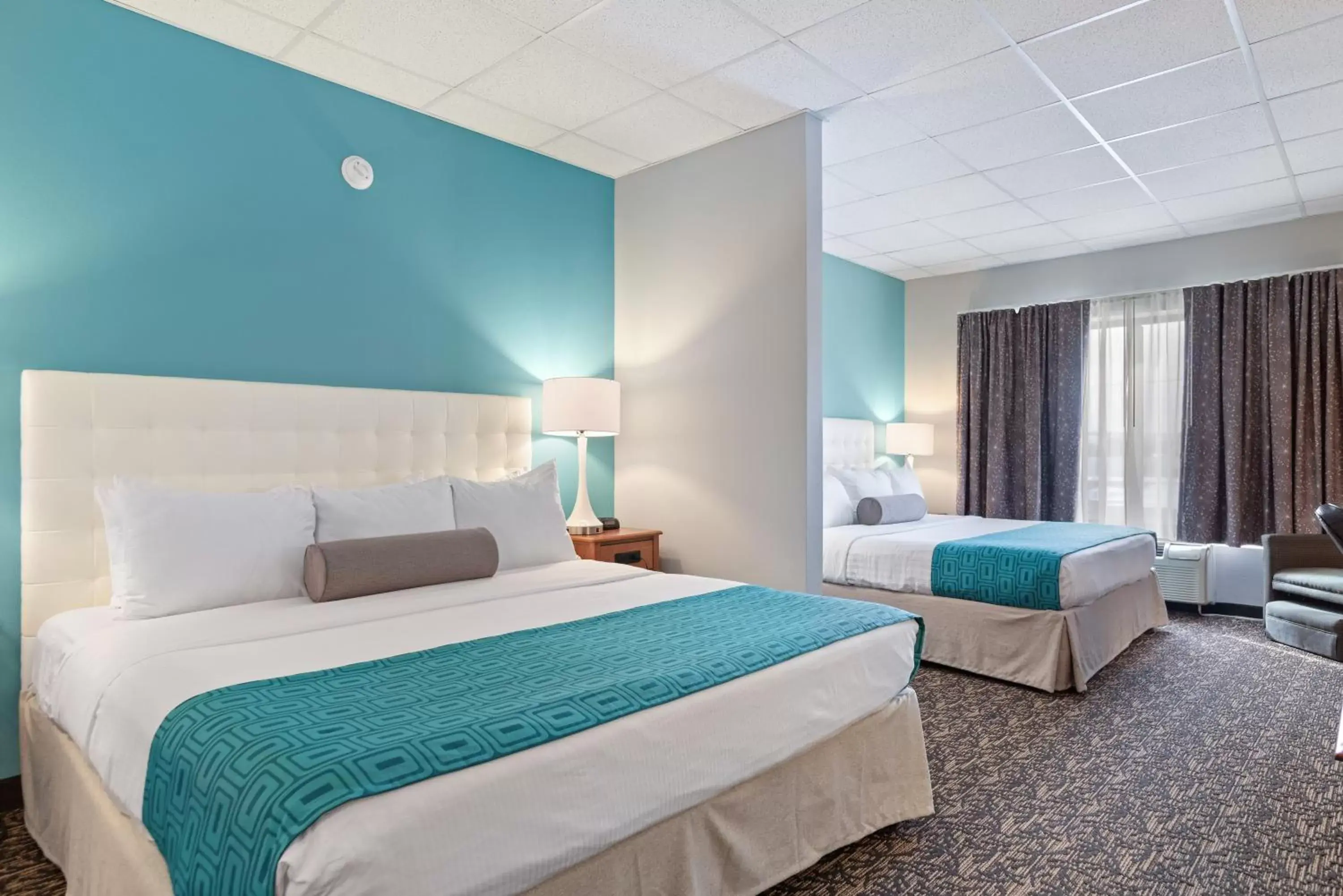 Bed in Howard Johnson by Wyndham Rapid City