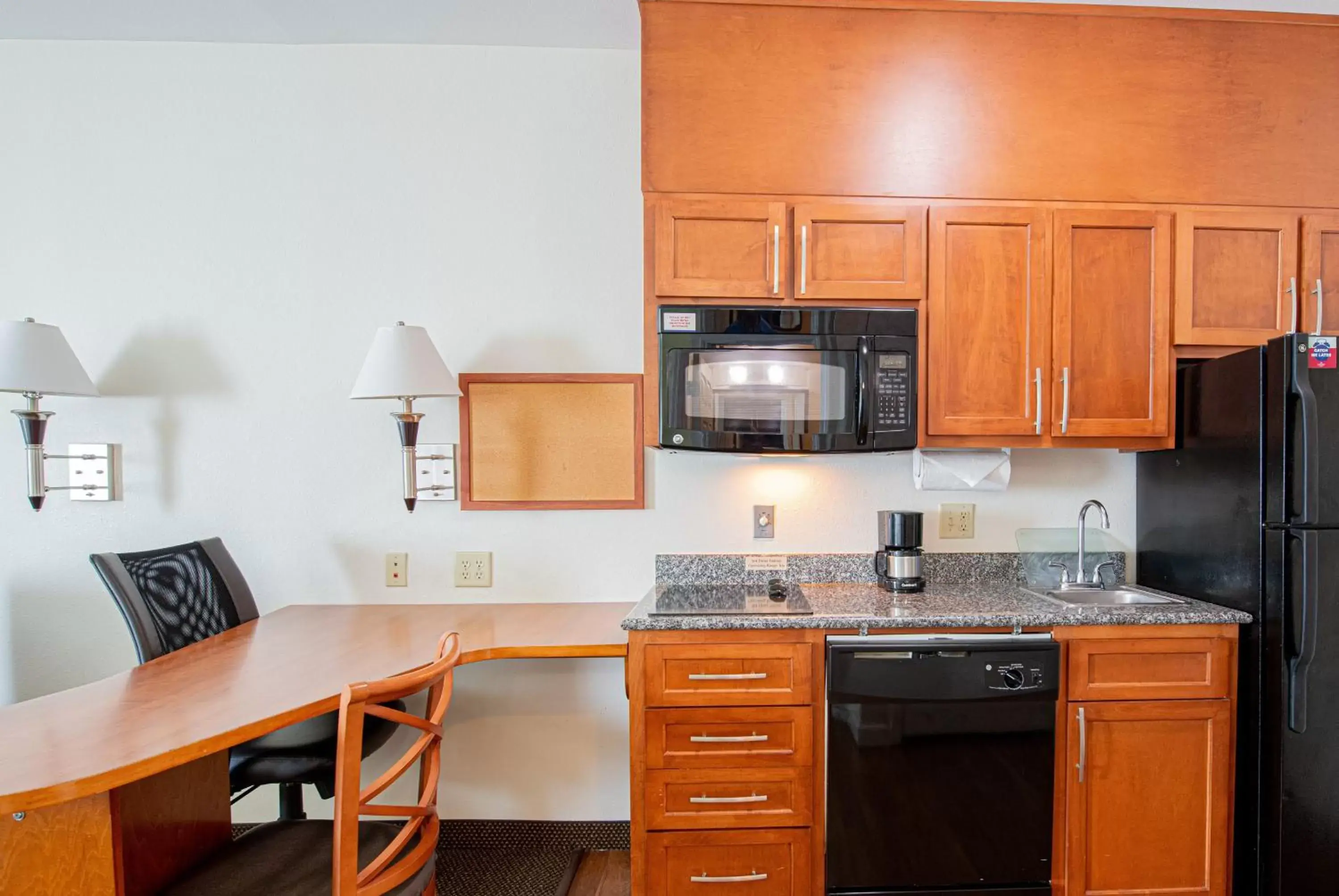 Photo of the whole room, Kitchen/Kitchenette in Candlewood Suites New Iberia, an IHG Hotel