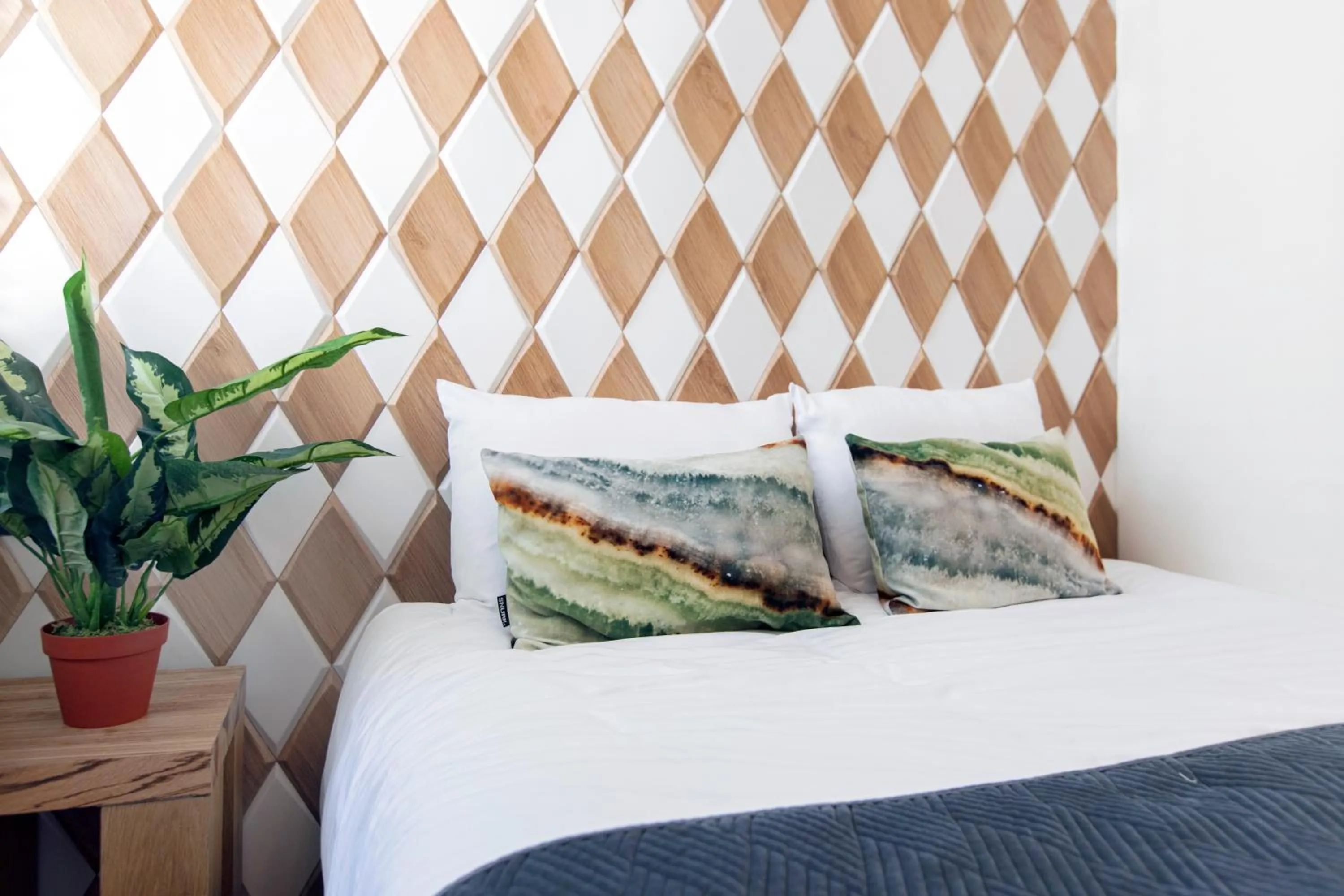 Bed in Quentin Golden Bear Hotel