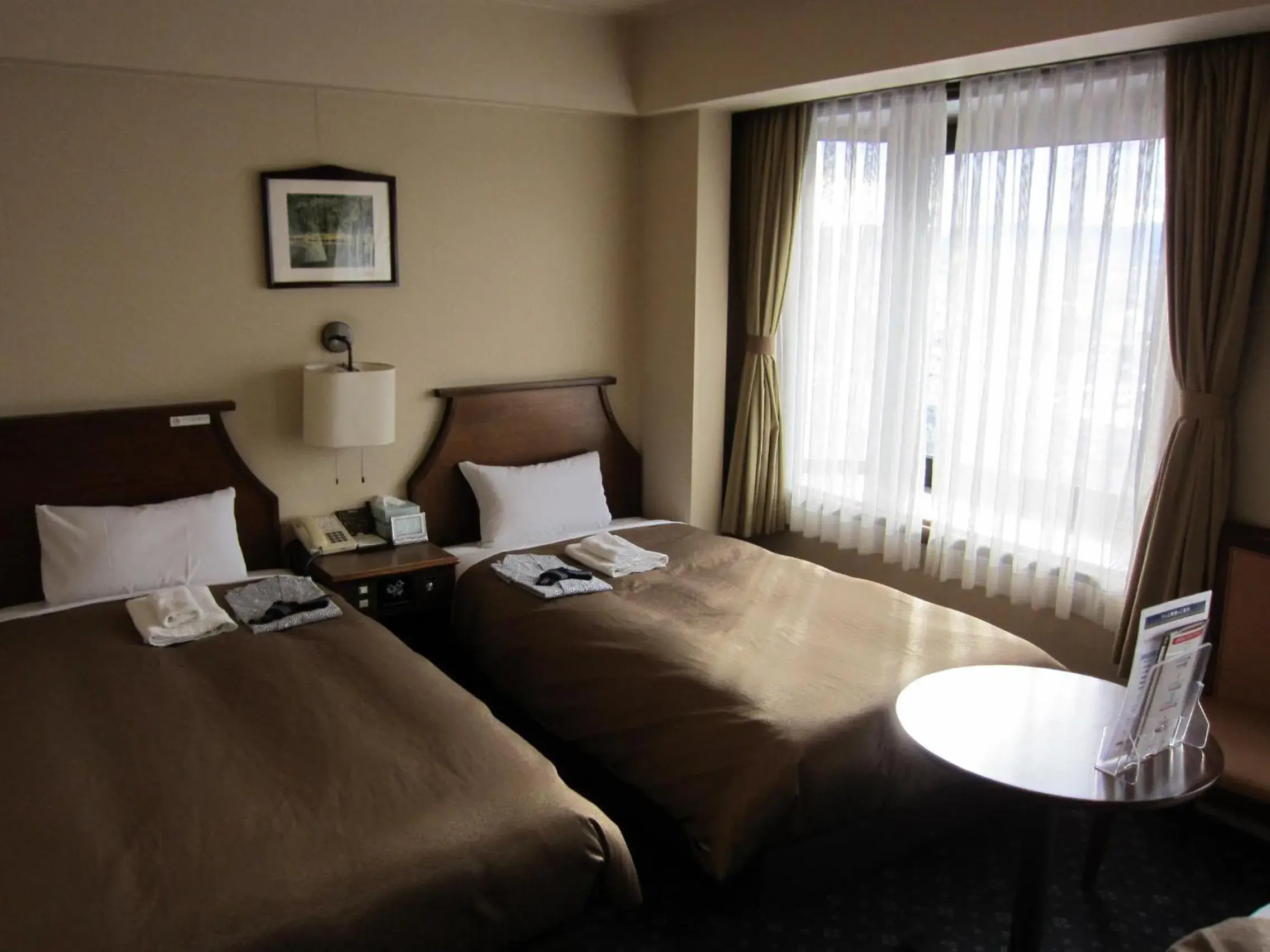 Photo of the whole room, Bed in Hotel New Station