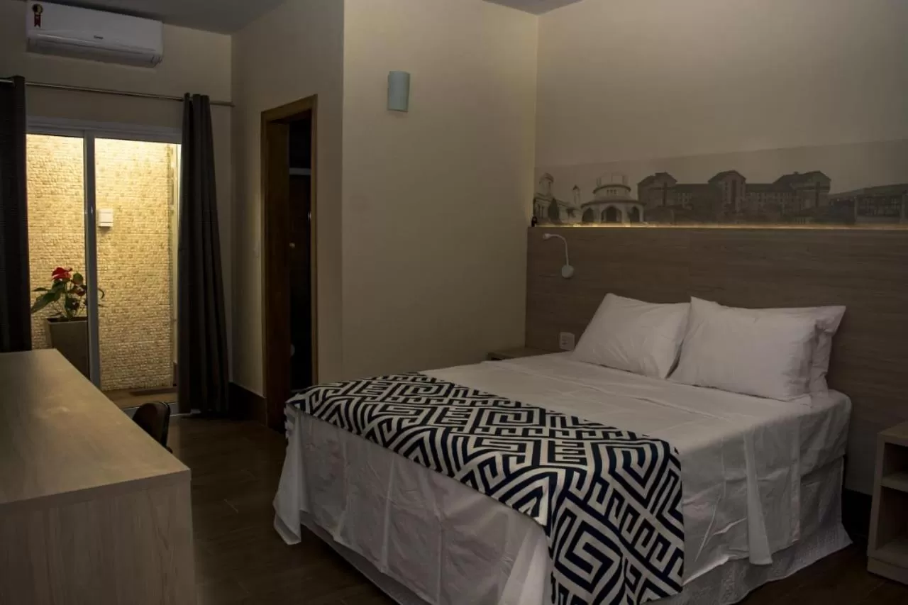 Bed in Pousada Araxá